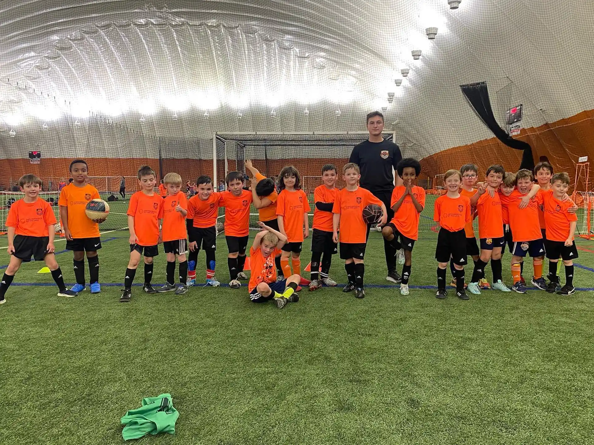 a group of football players posing for a photo
