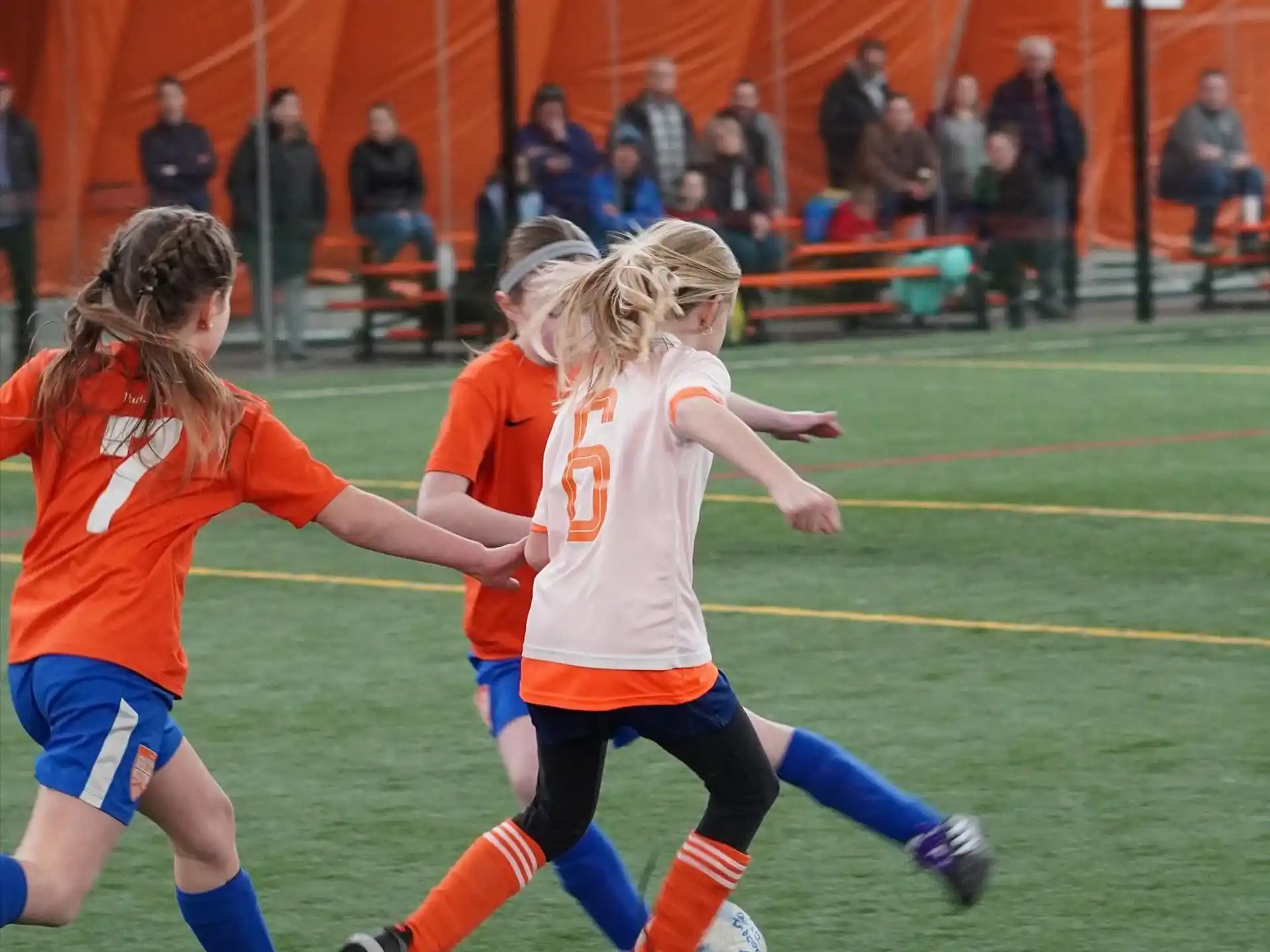 a group of girls playing football
