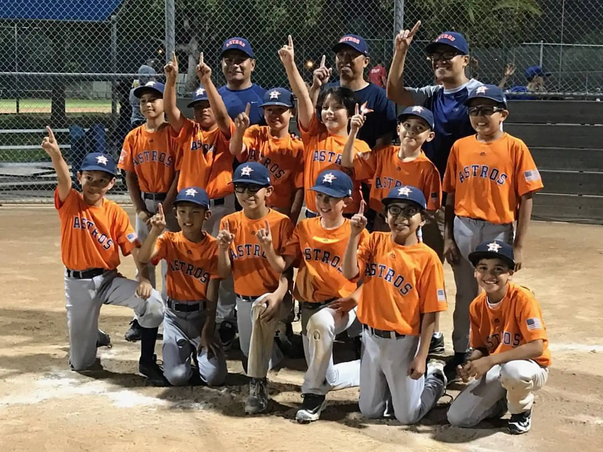 a group of kids posing for a photo