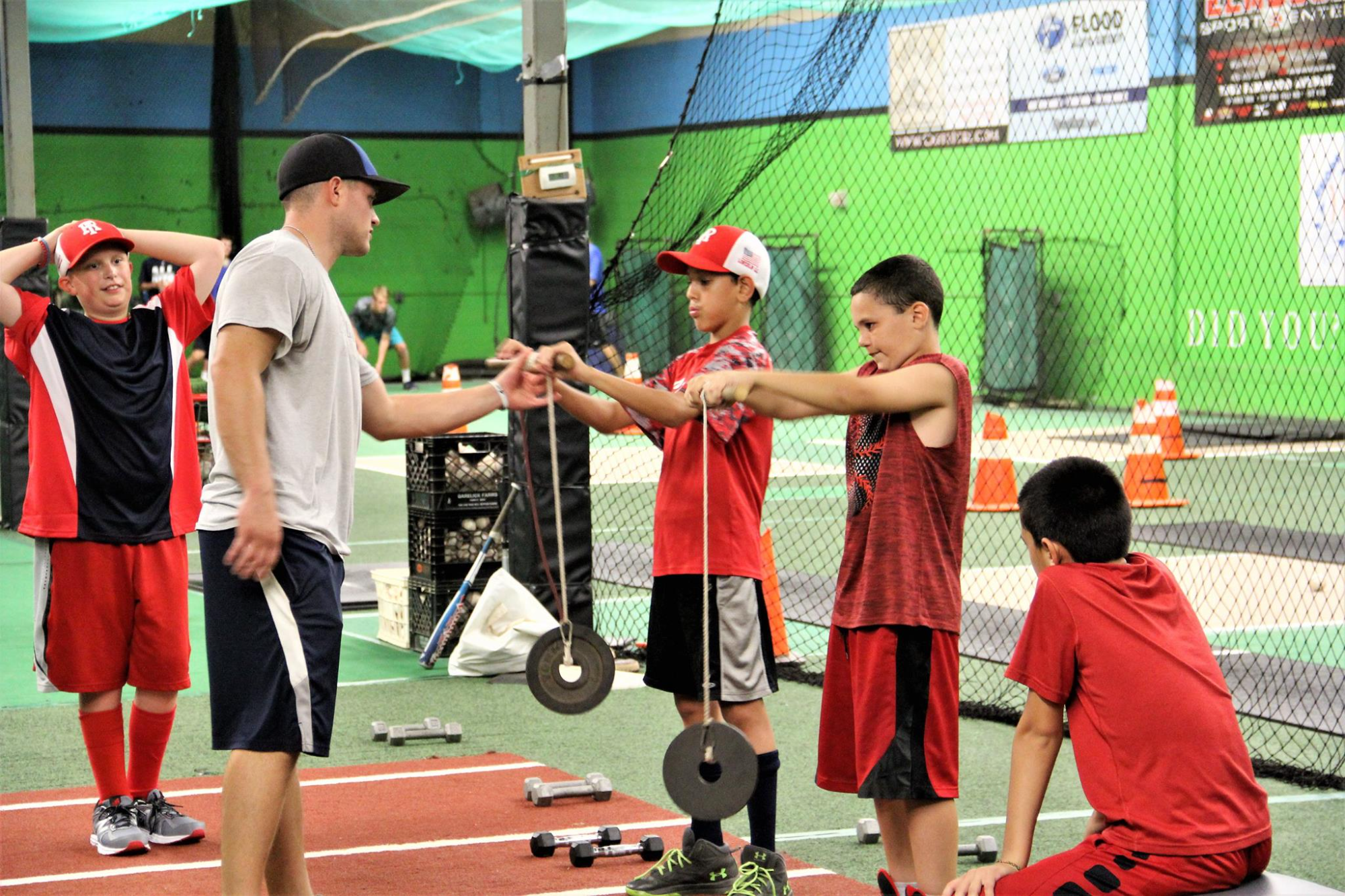 a group of kids playing baseball
