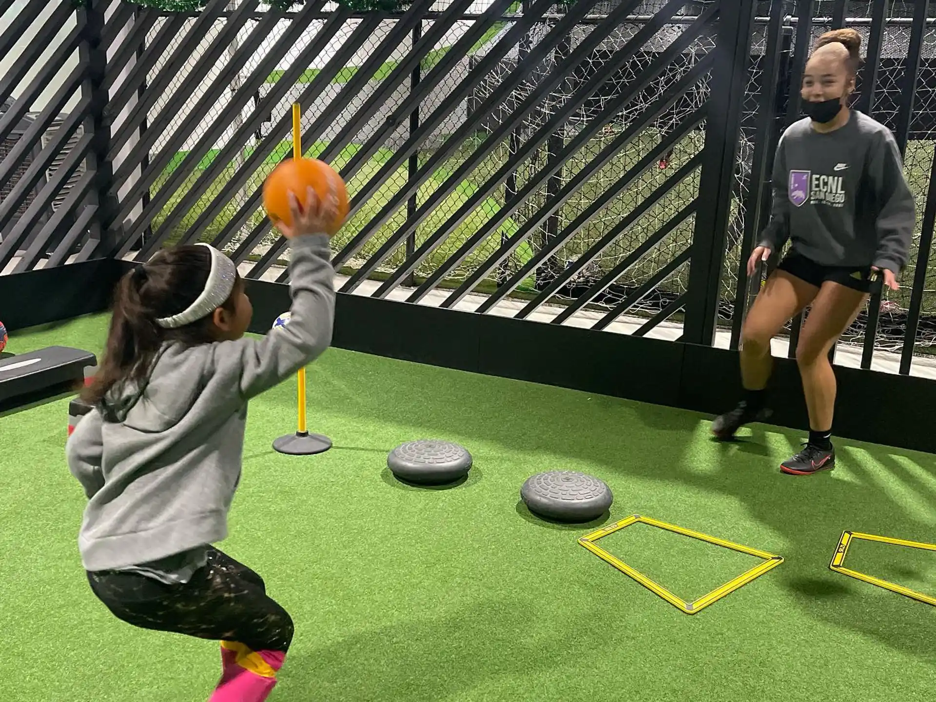 a girl shooting a basketball