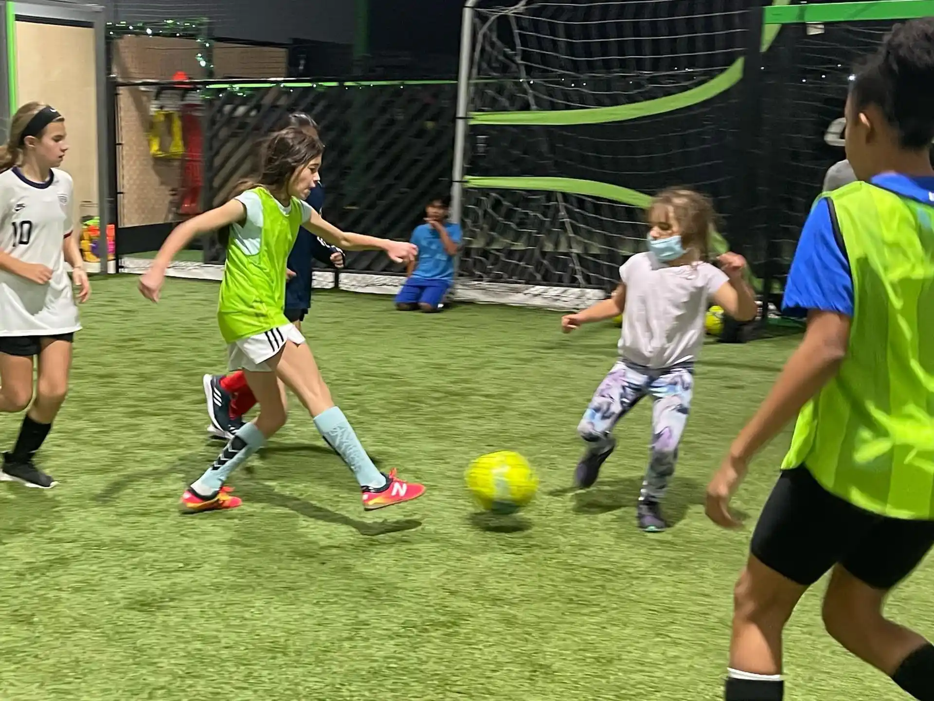 a group of kids playing football