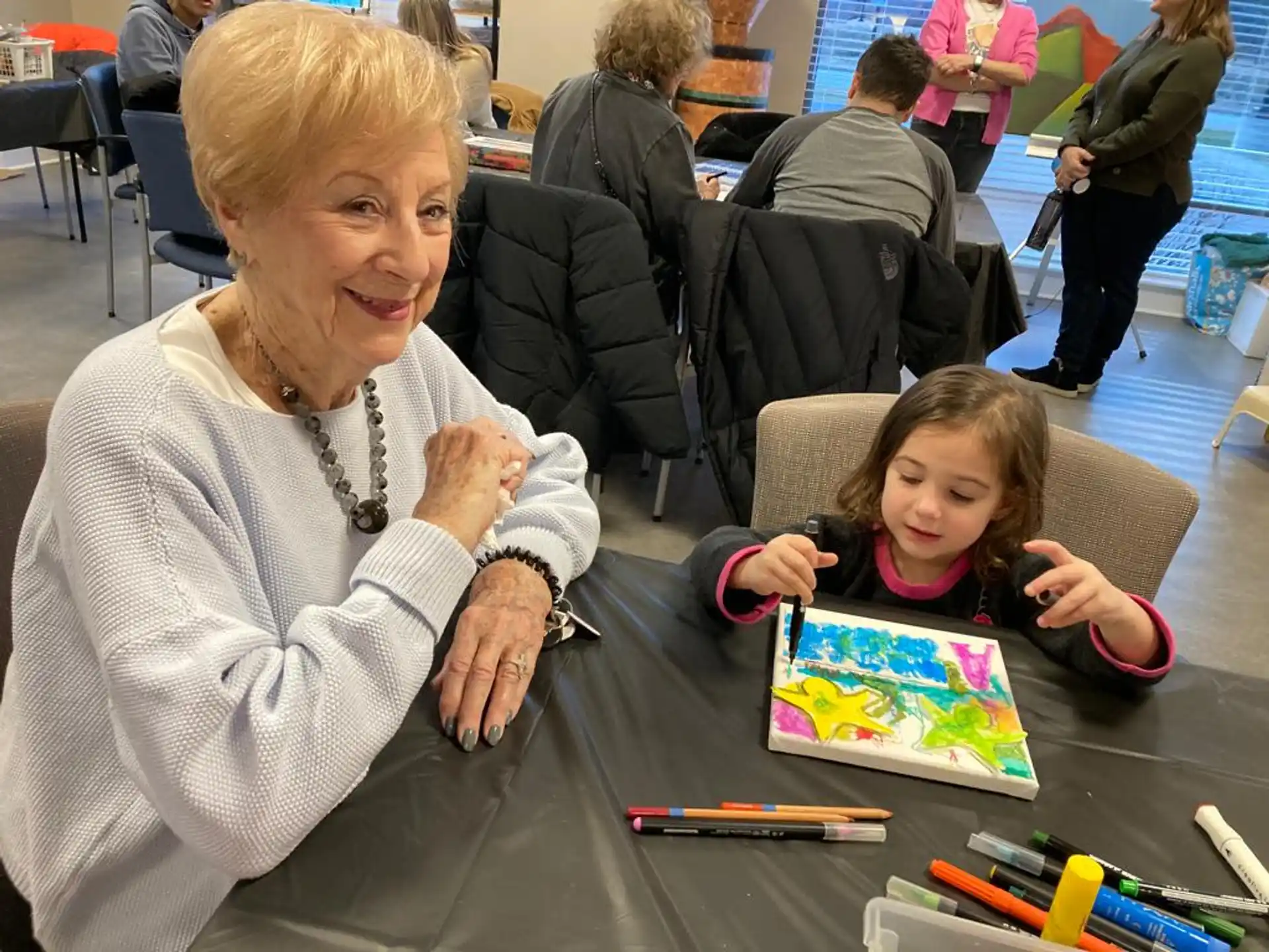 a person and a child sitting at a table