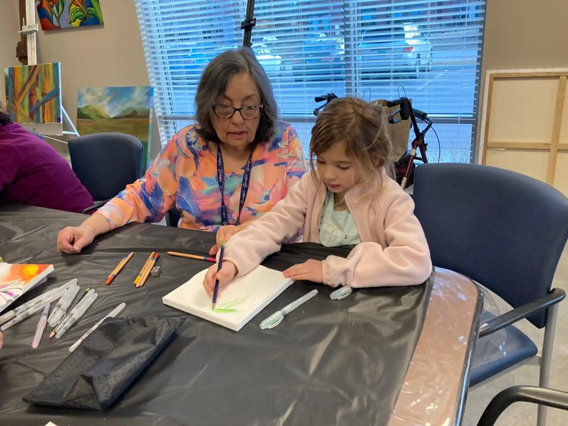 a person and a girl painting