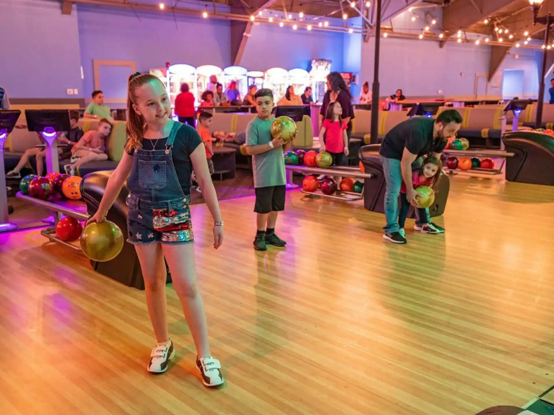 a group of people playing bowling