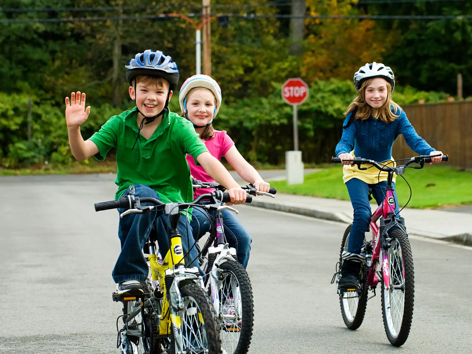 a group of kids riding bikes