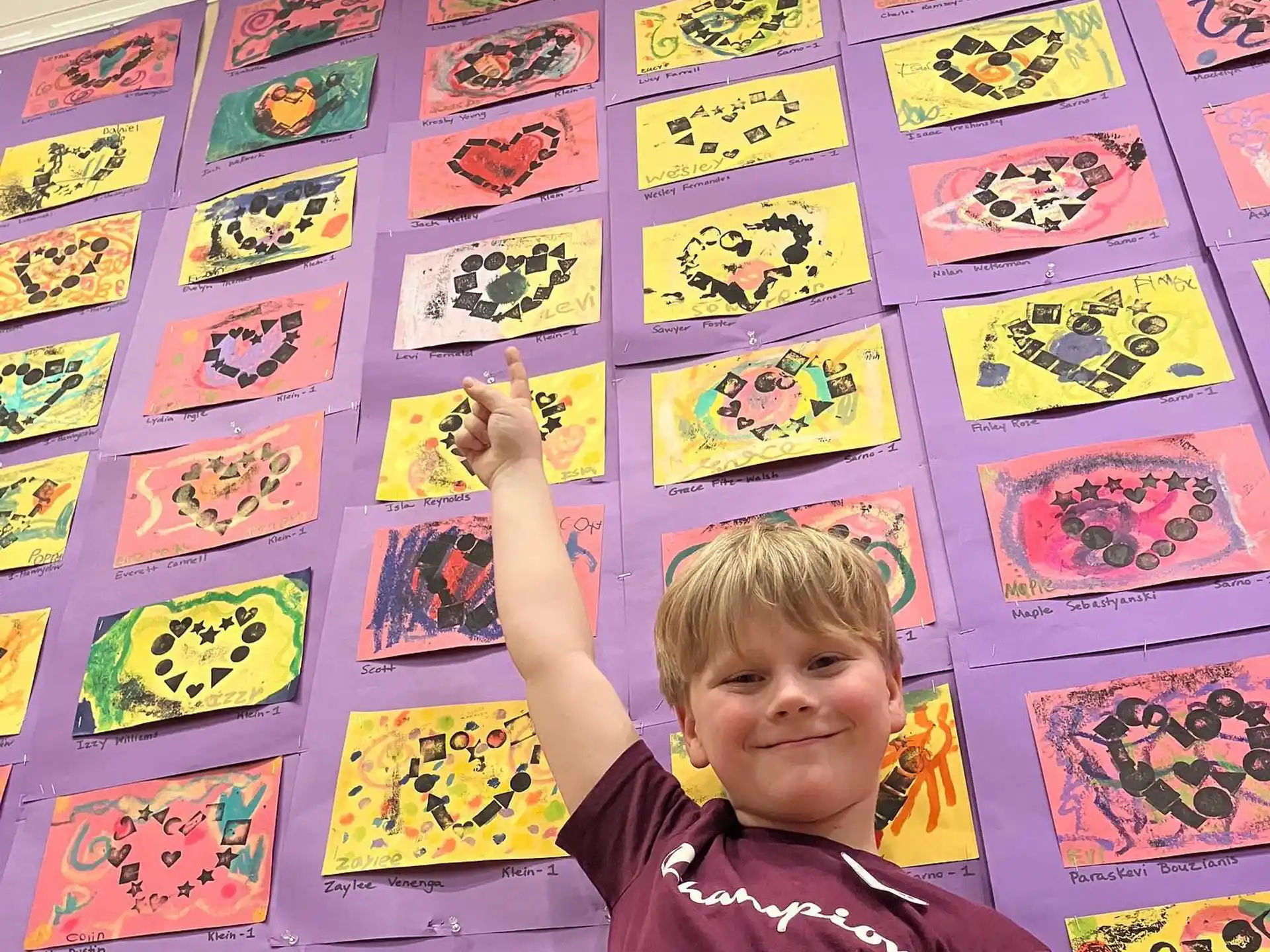 a boy holding up his hands