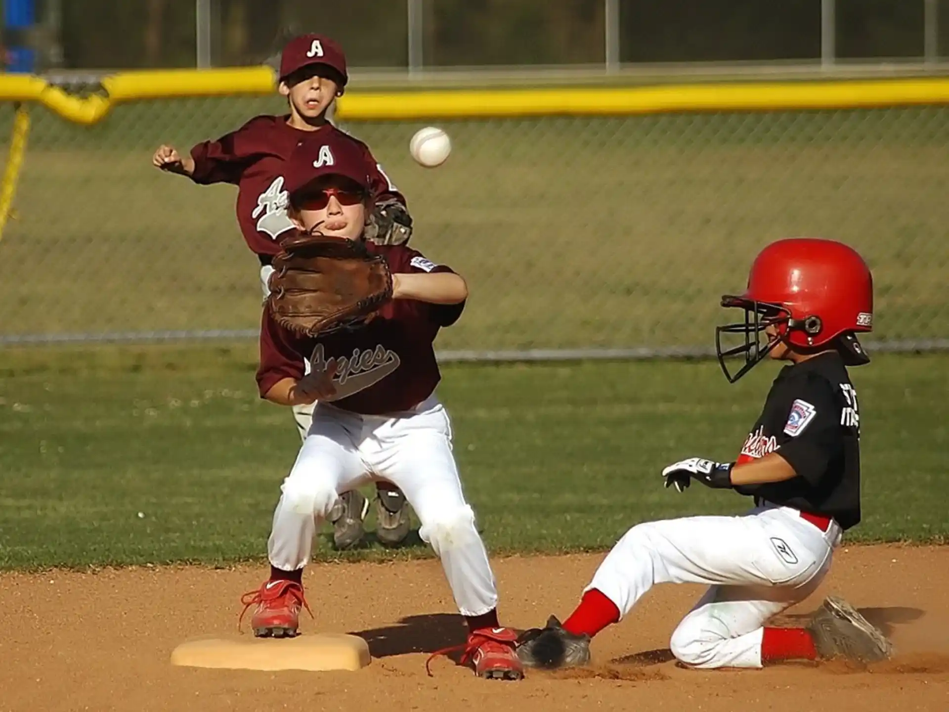 a couple of kids playing baseball
