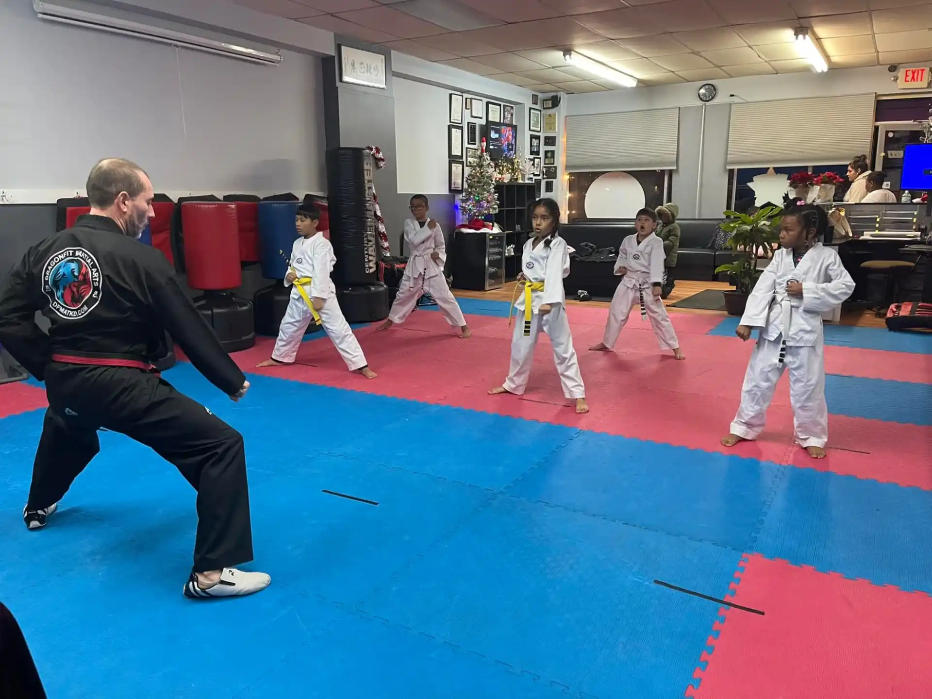 a group of people in karate uniforms