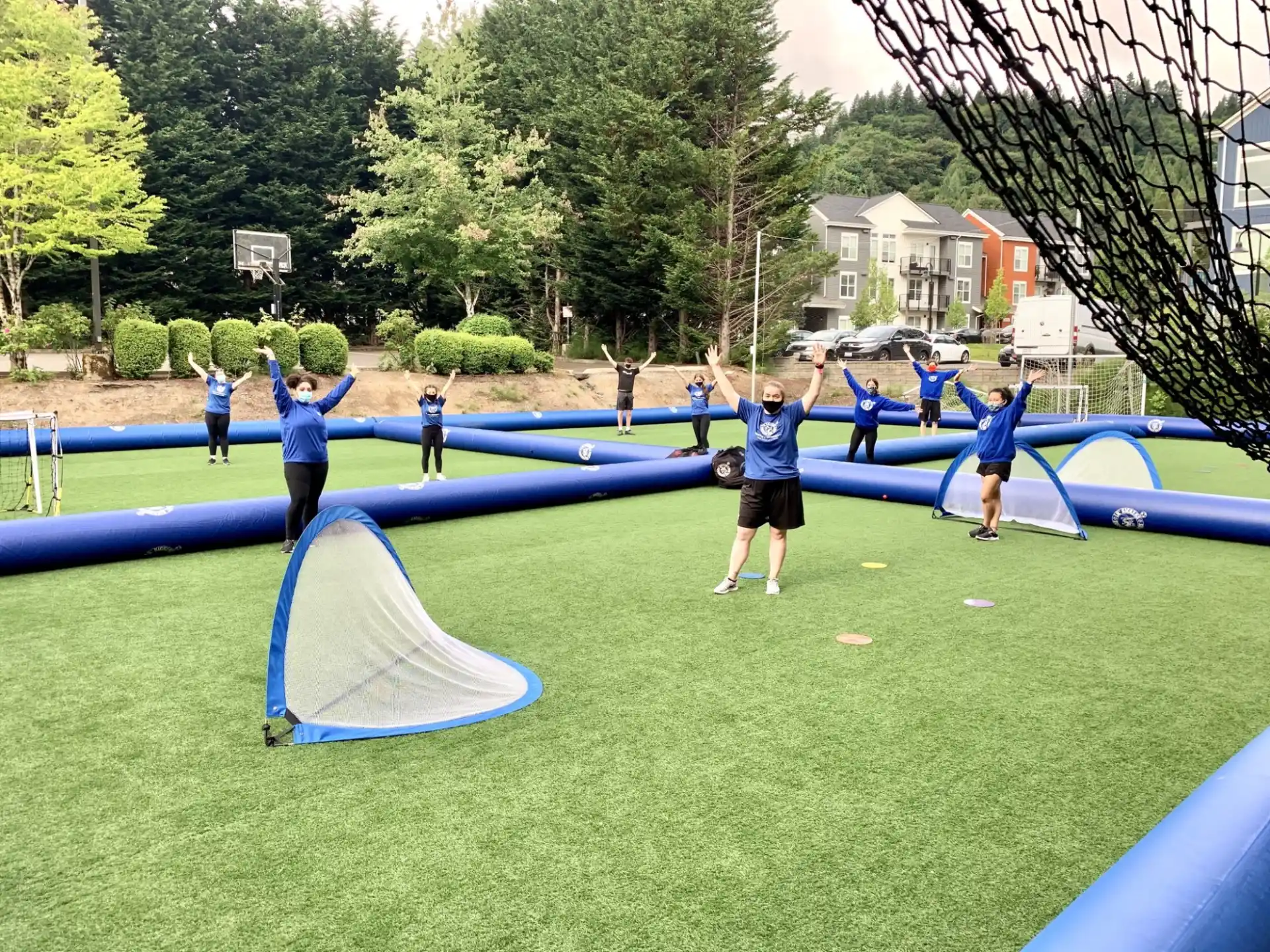 a group of people playing basketball