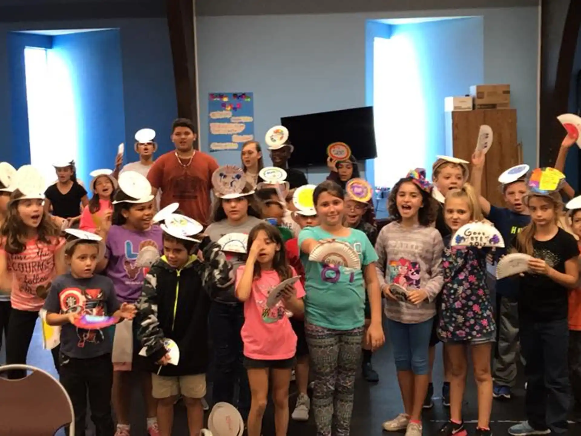 a group of children wearing hats