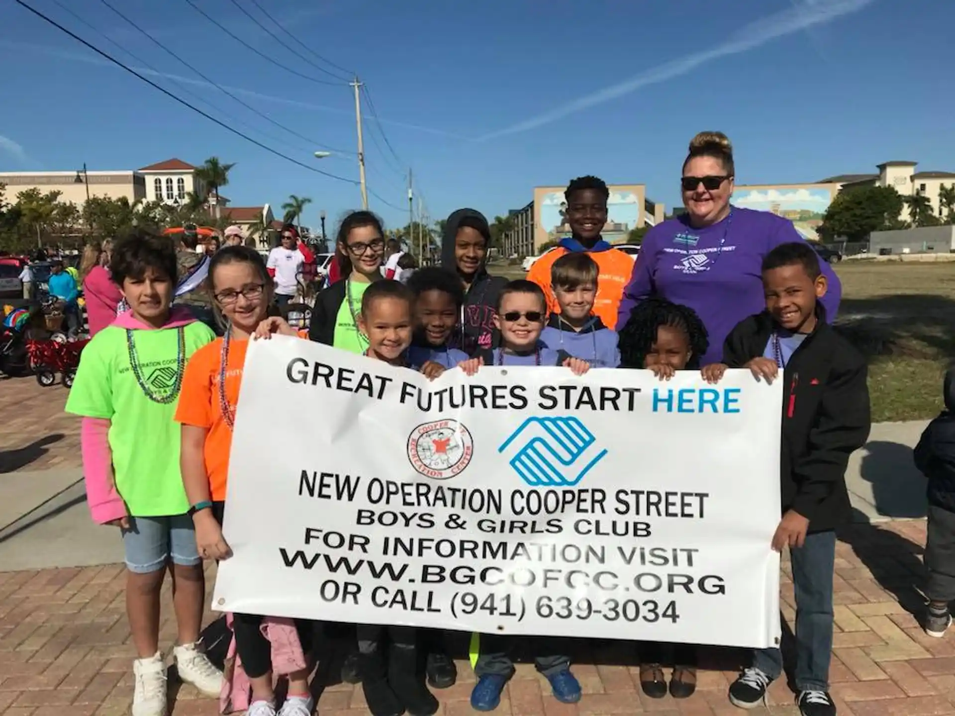 a group of people holding a sign