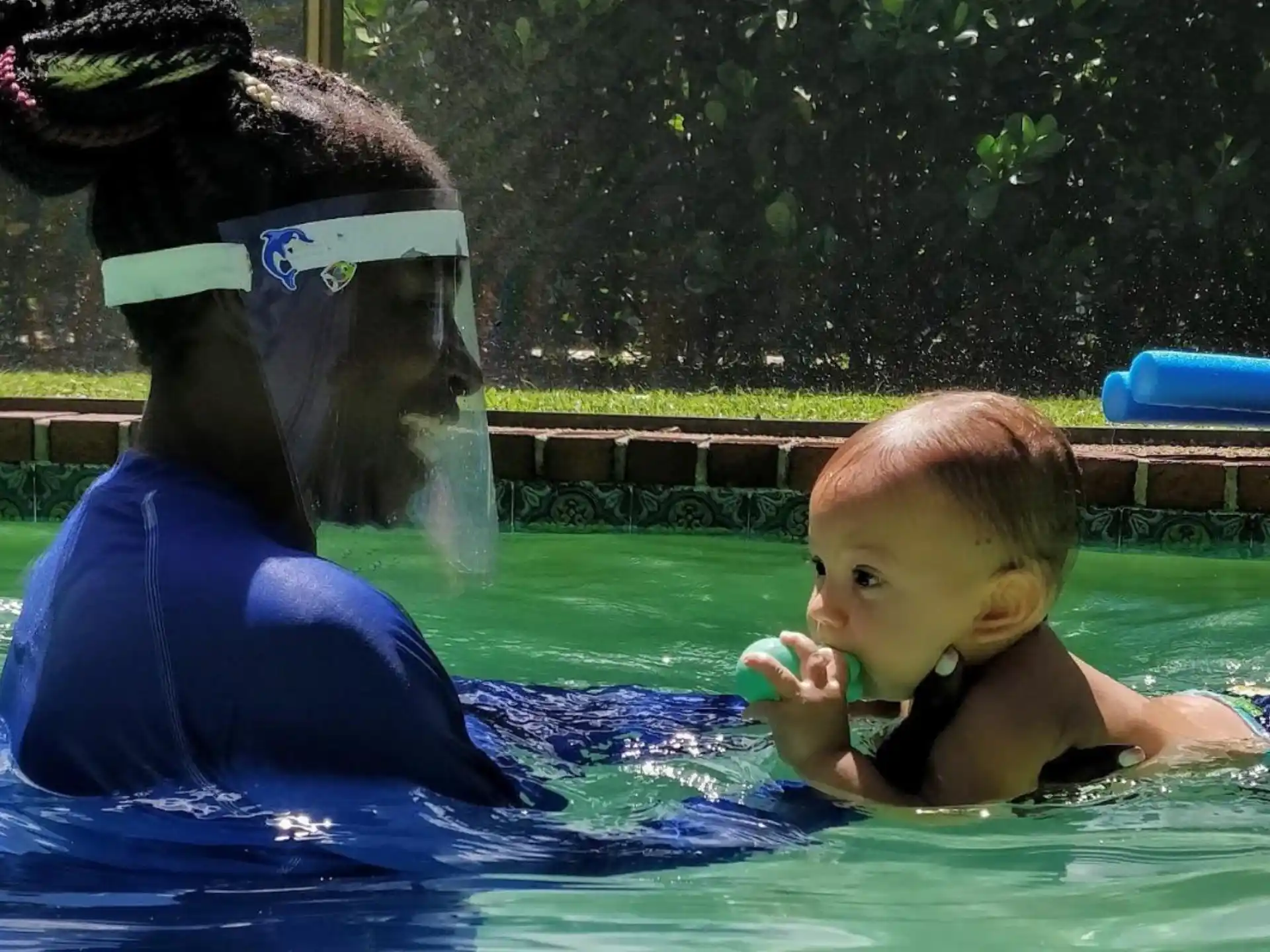 a baby in a pool