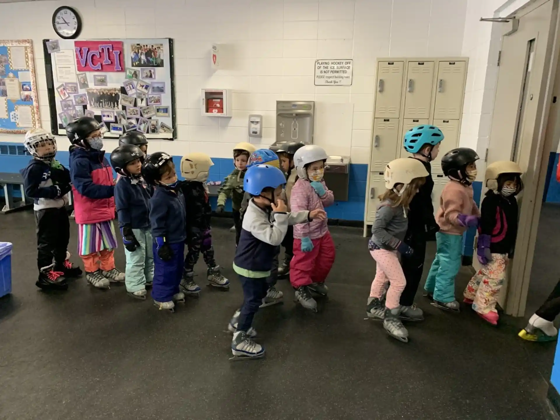 a group of children wearing helmets