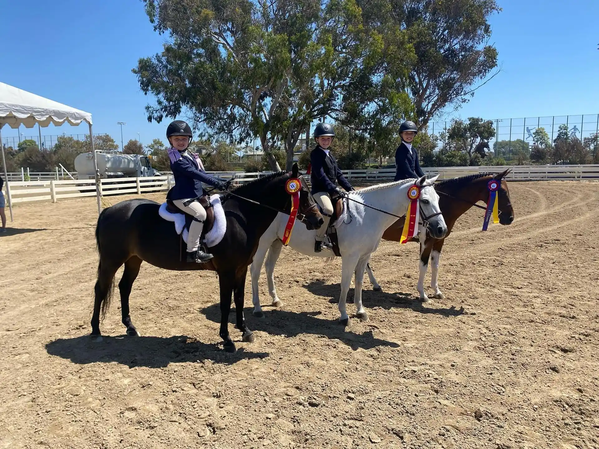 a group of people riding horses