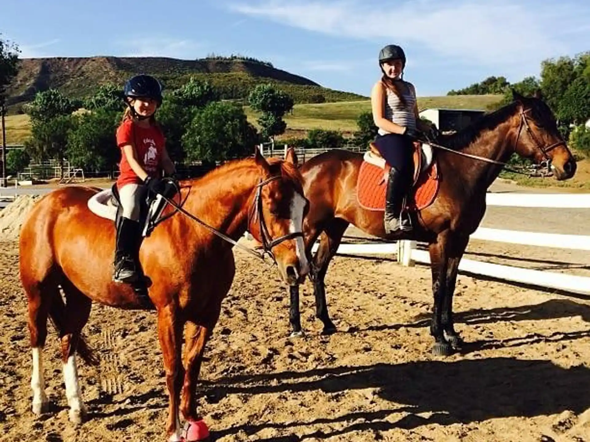 two people riding horses