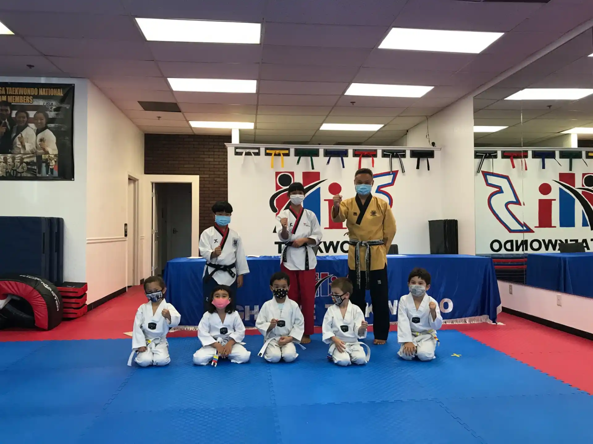 a group of kids posing for a photo