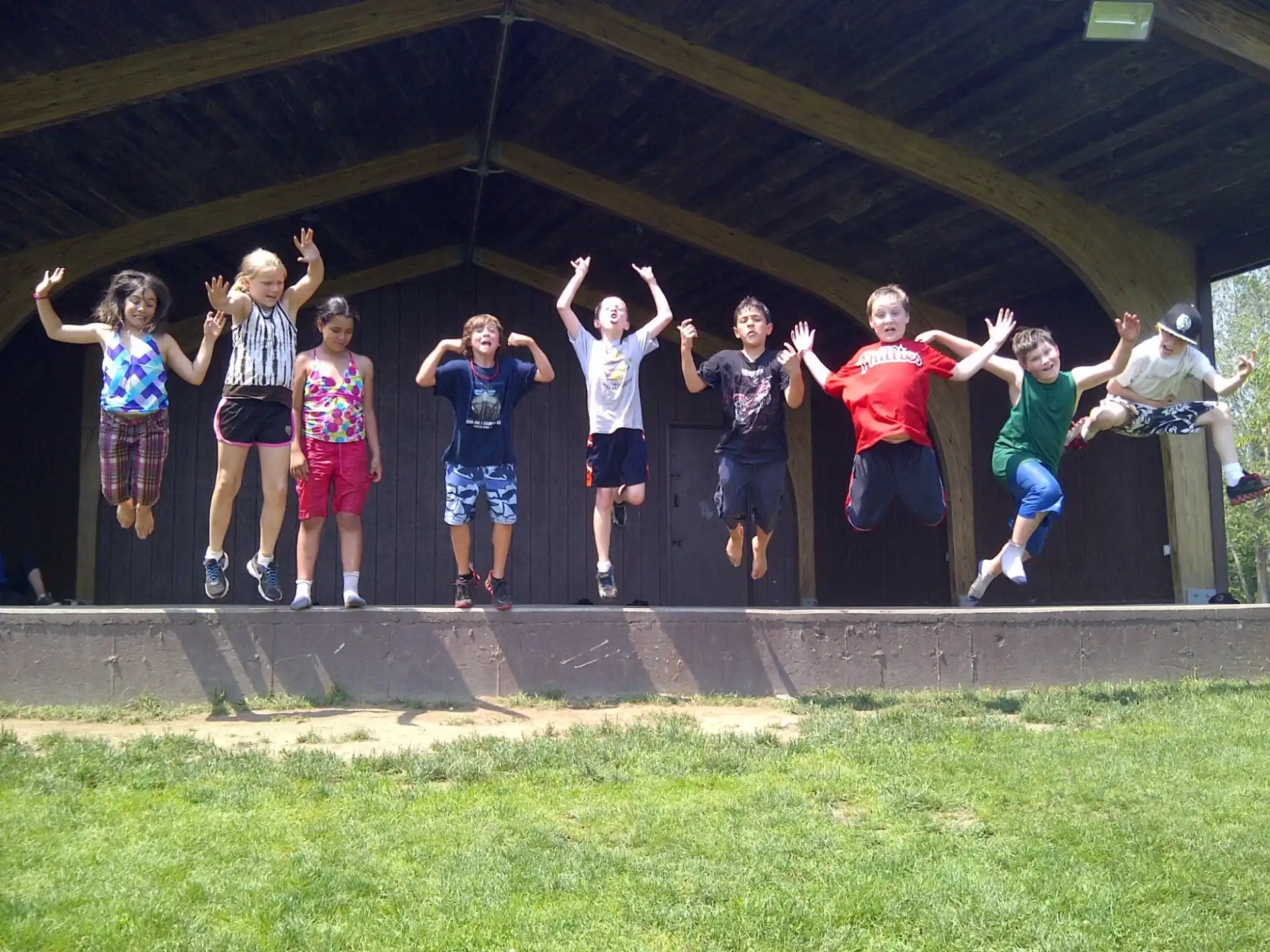 a group of people jumping in the air