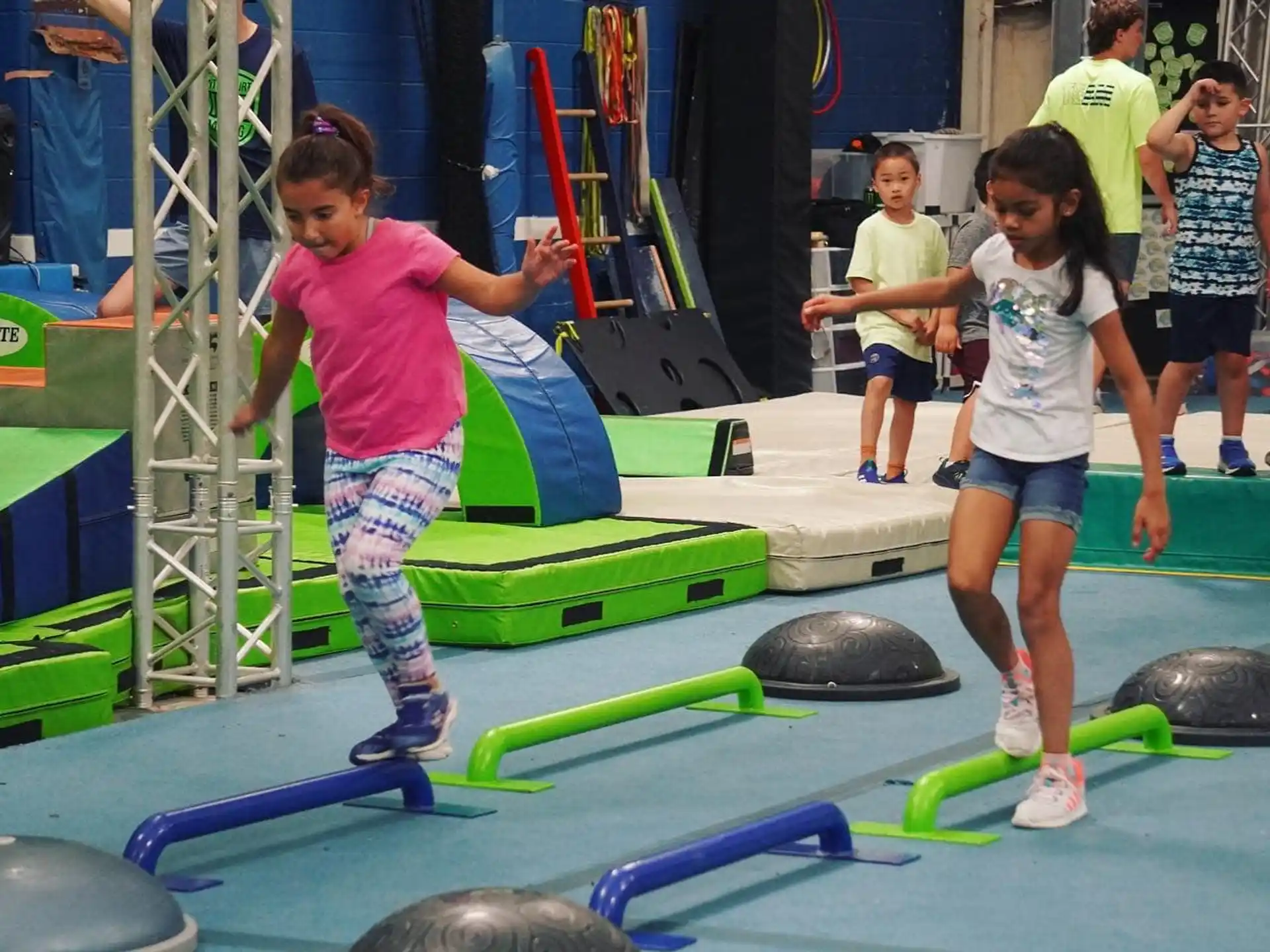 a group of children playing on a trampoline
