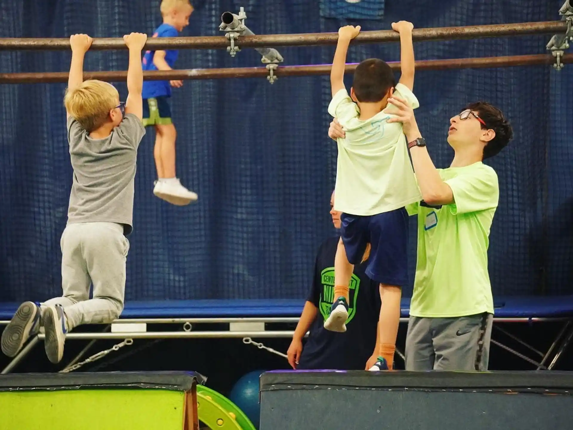a group of people jumping on a trampoline