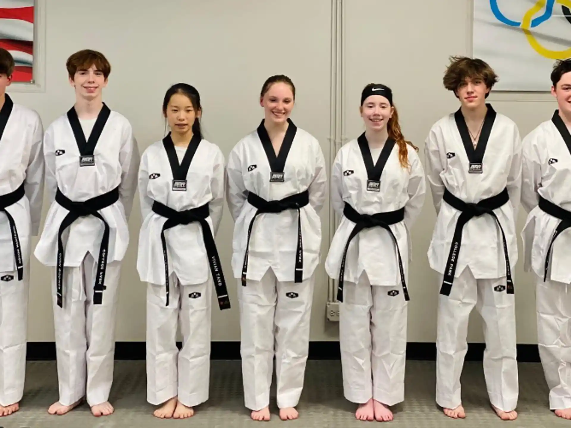a group of people in karate uniforms