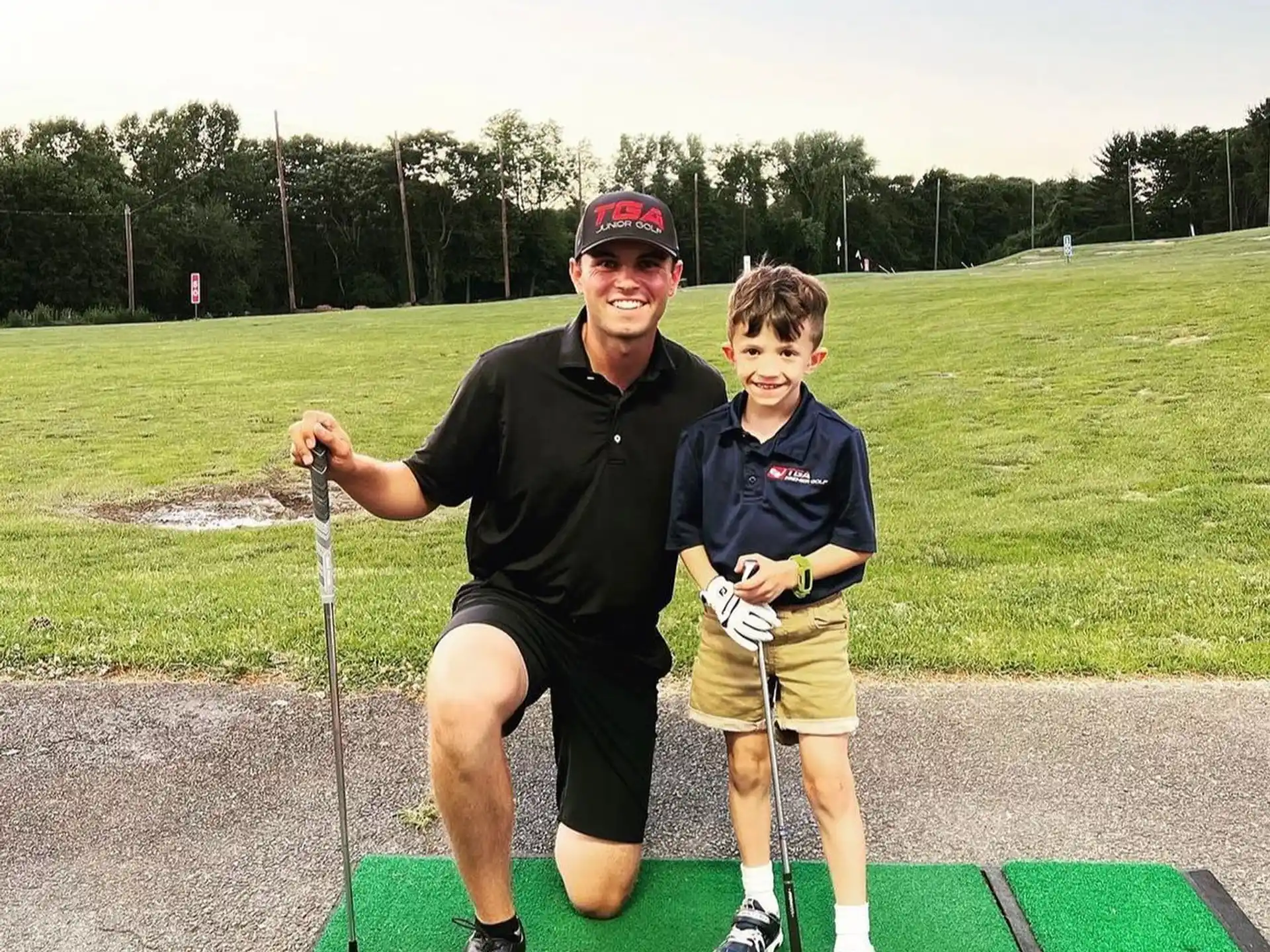 a man and a boy playing golf