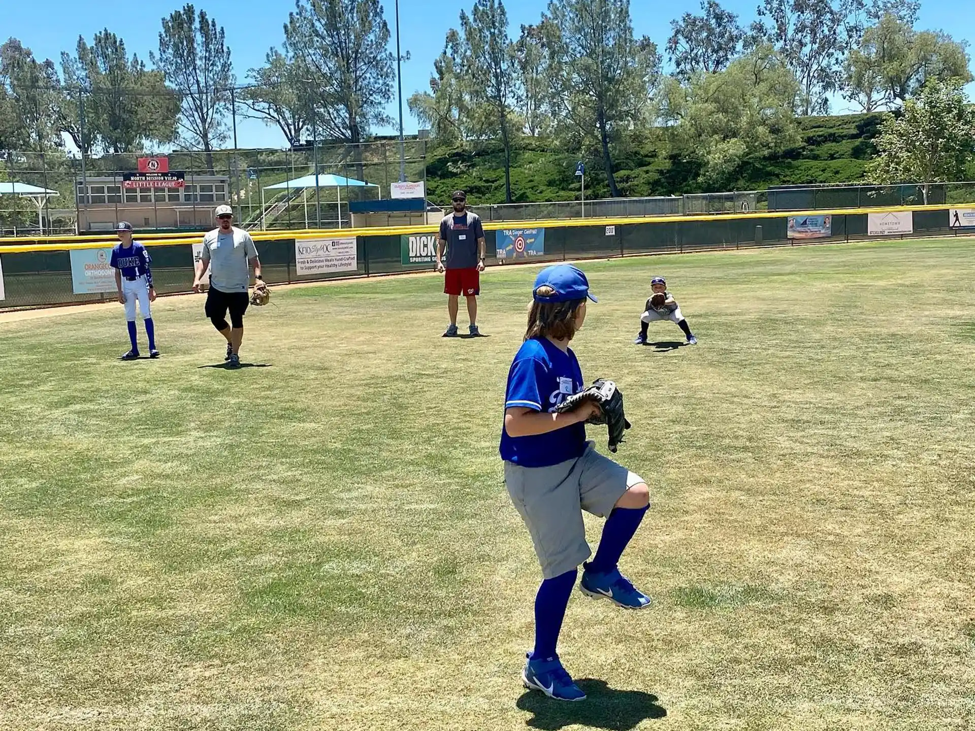 a girl playing baseball
