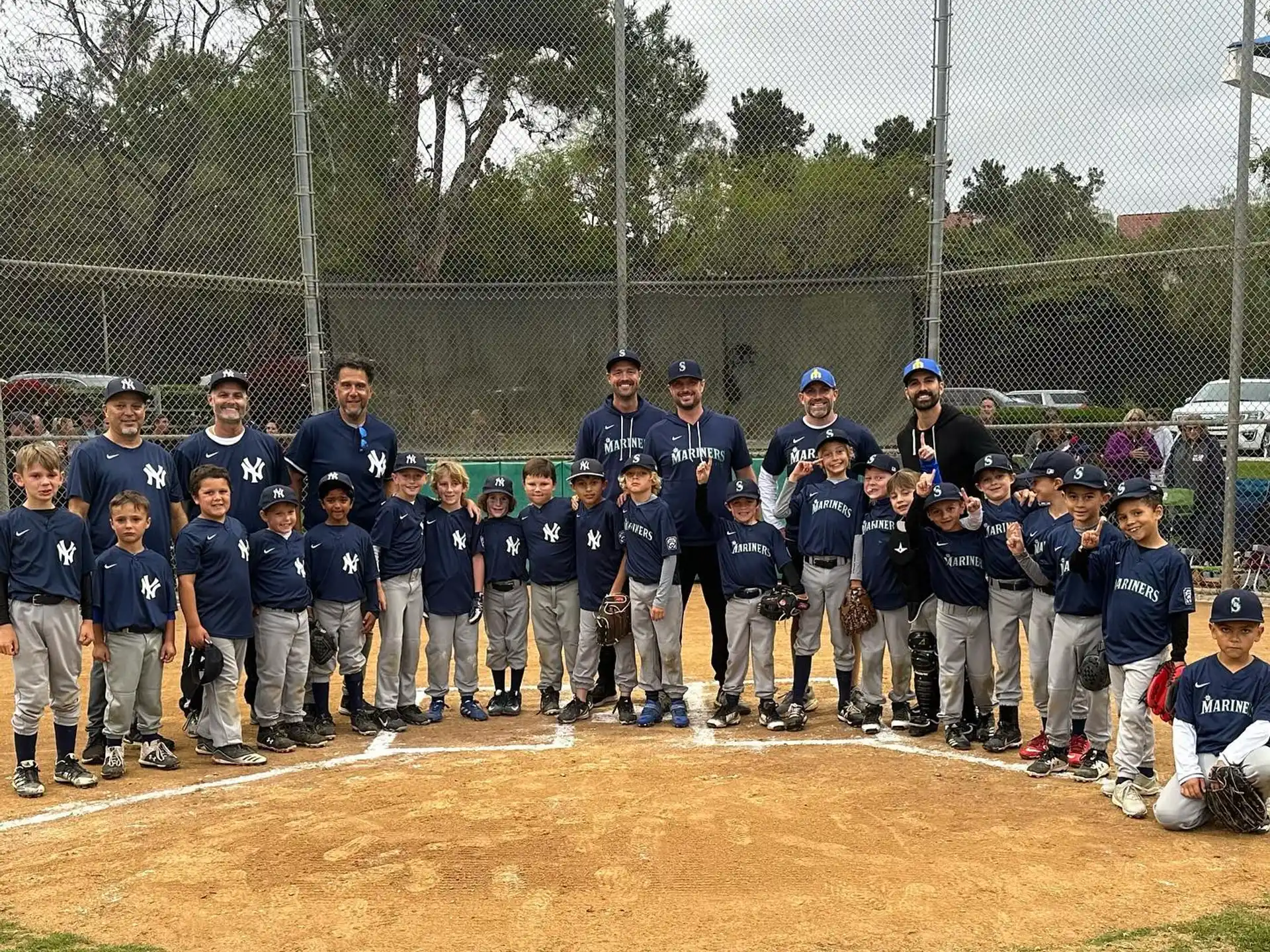 a group of baseball players posing for a photo