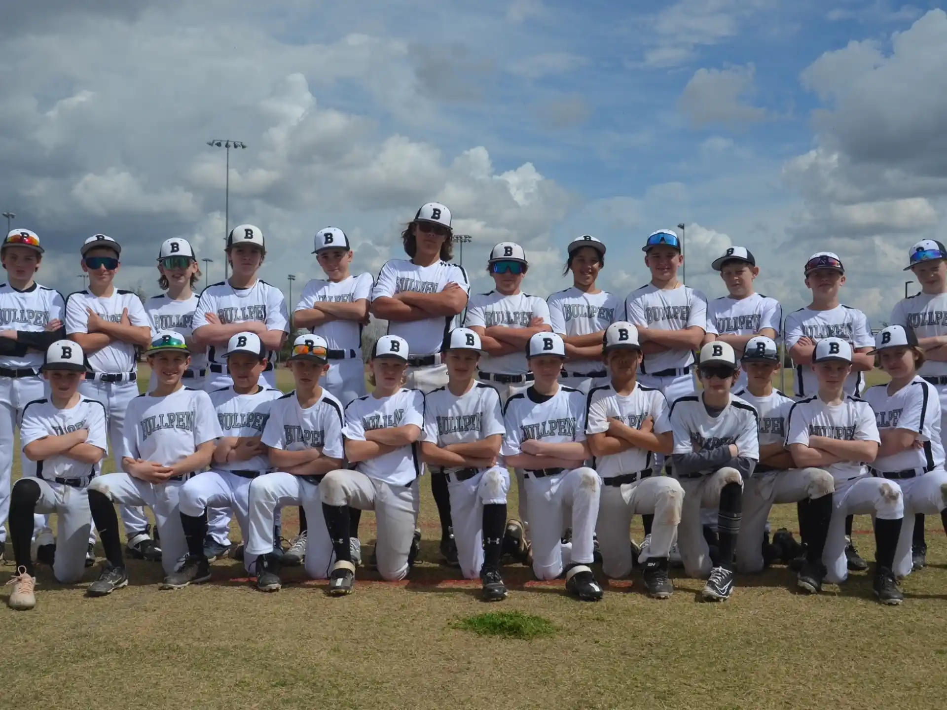 a group of baseball players posing for a photo