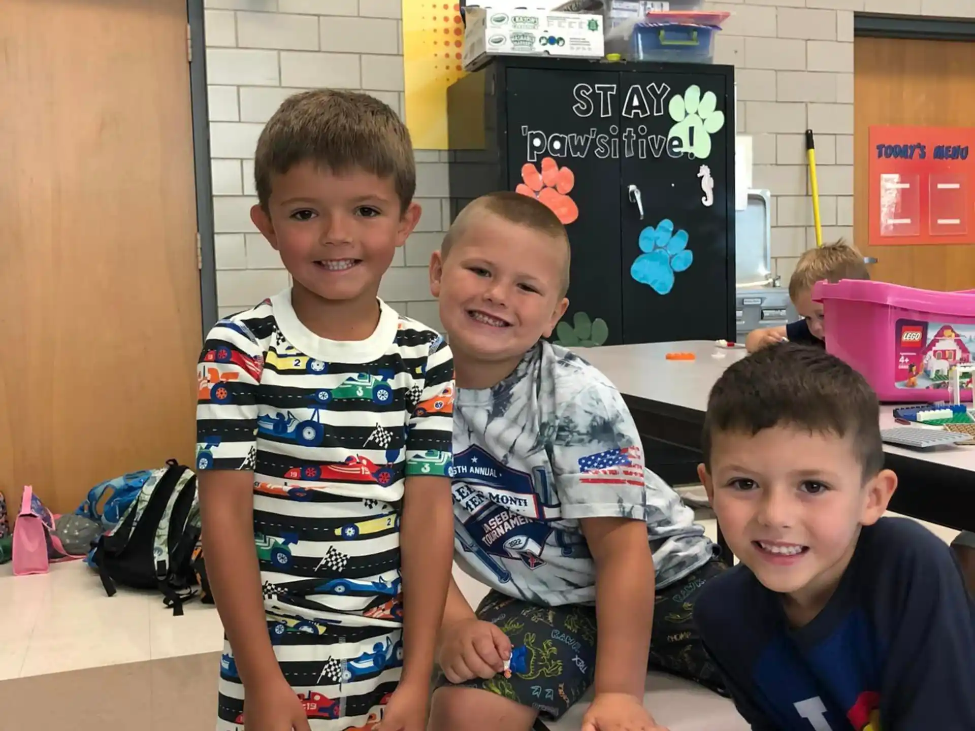 a group of boys sitting on the floor
