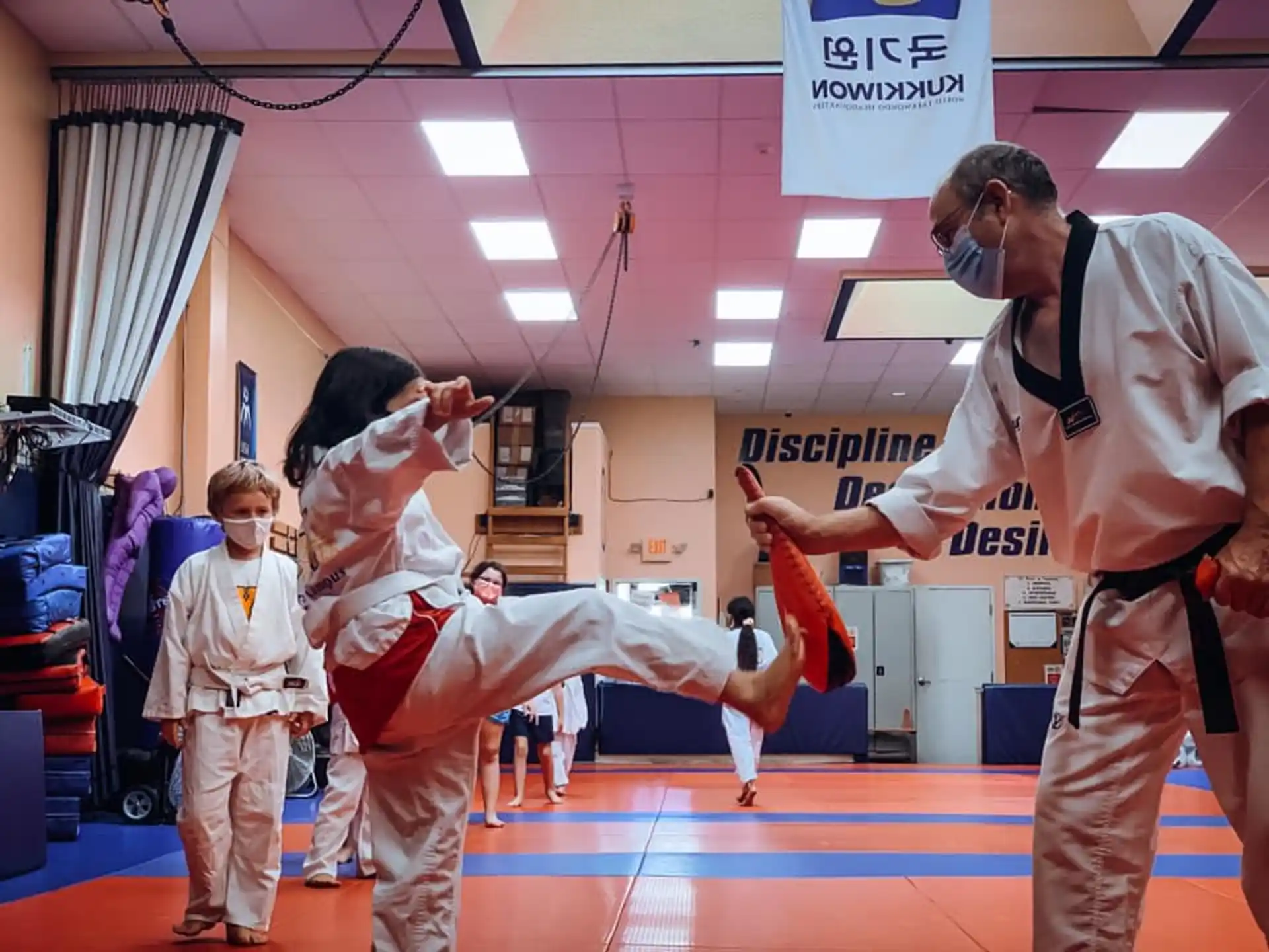 a group of people in karate uniforms