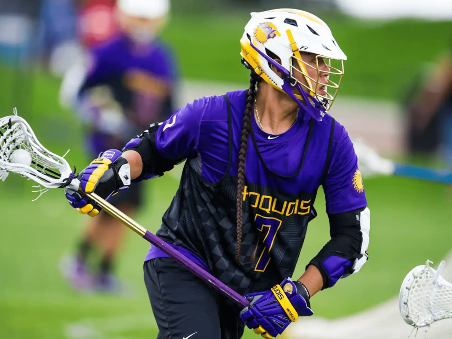 a person playing lacrosse