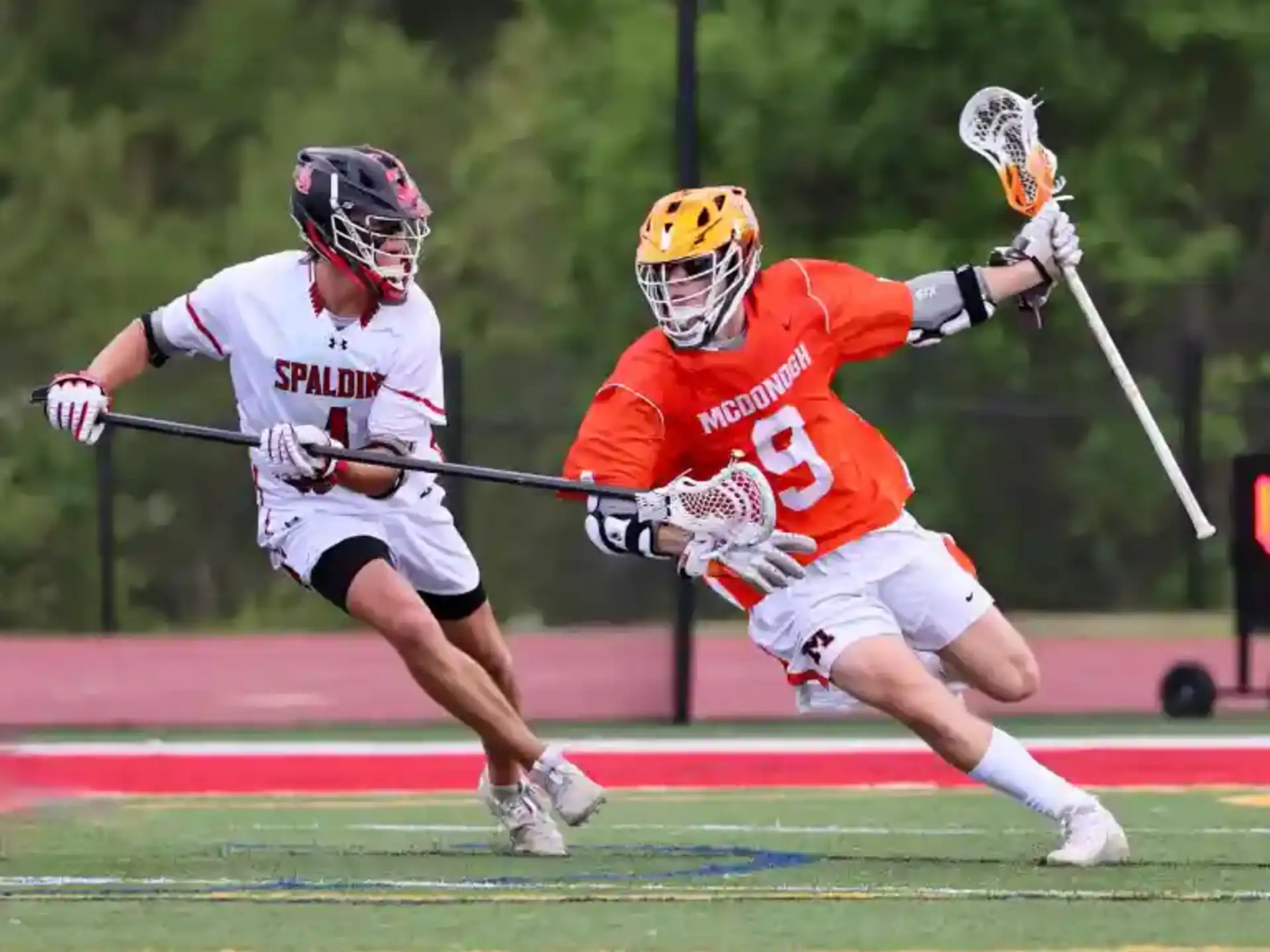 two men playing lacrosse