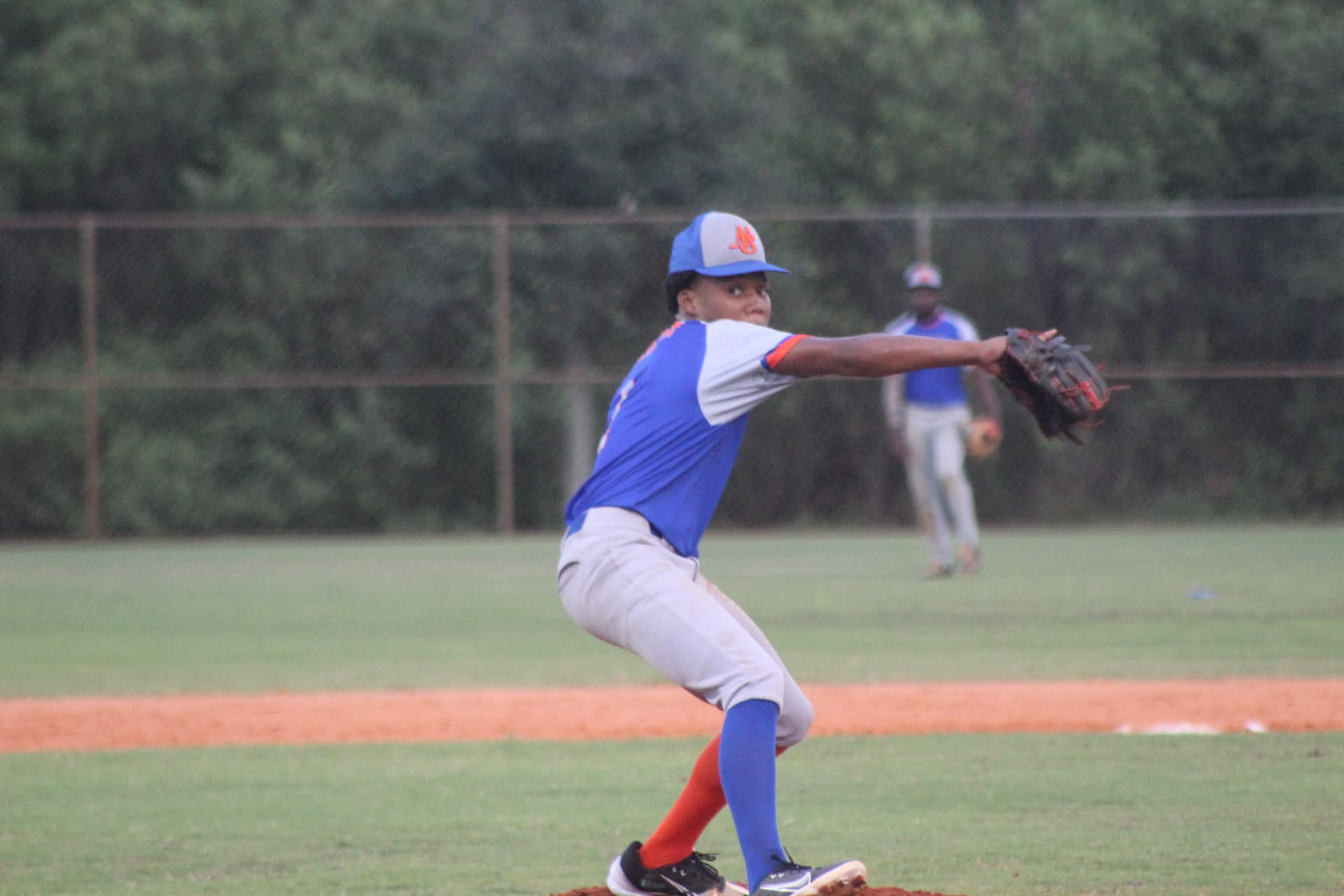 a baseball player throwing a ball
