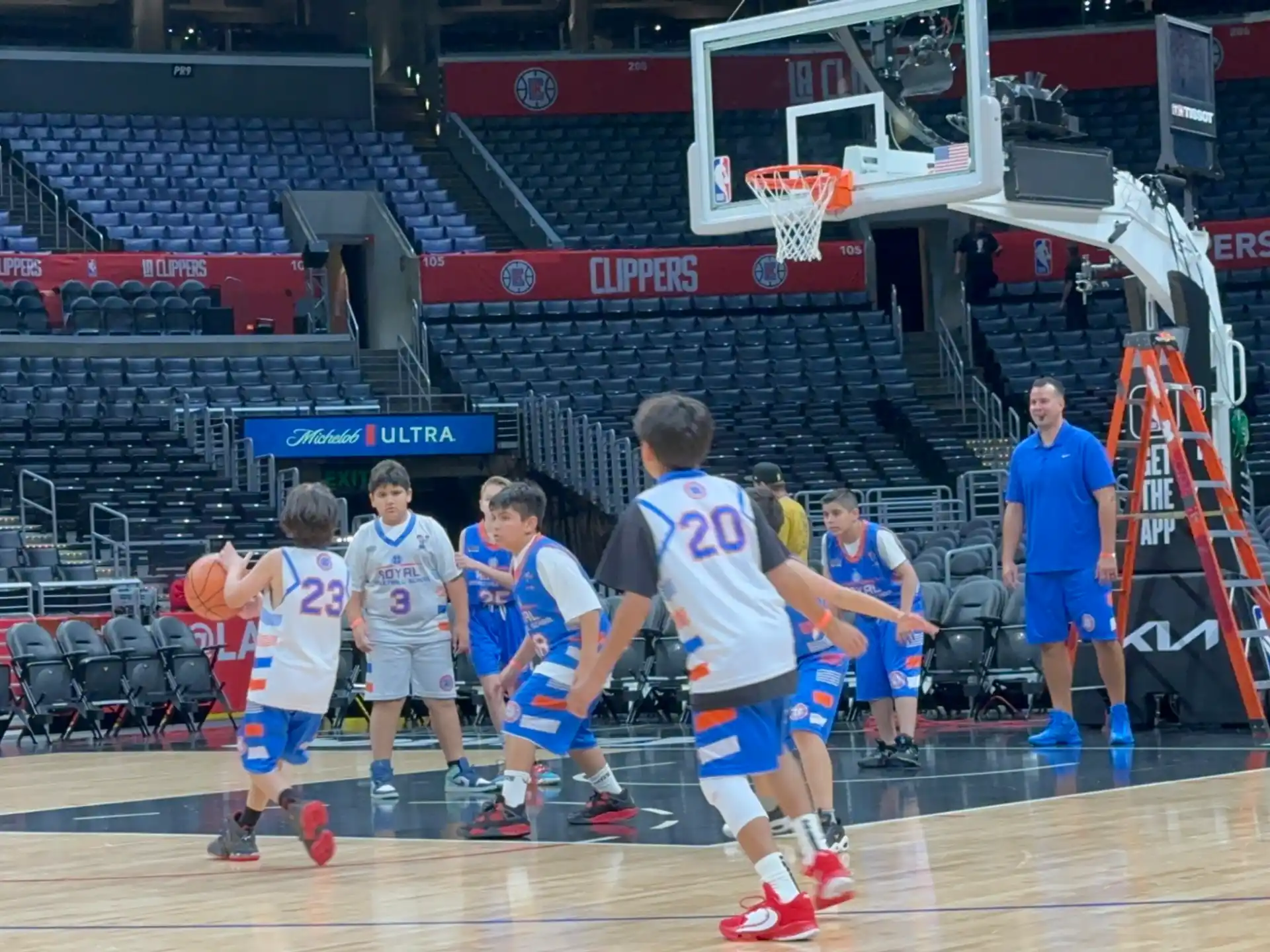 a group of people playing basketball