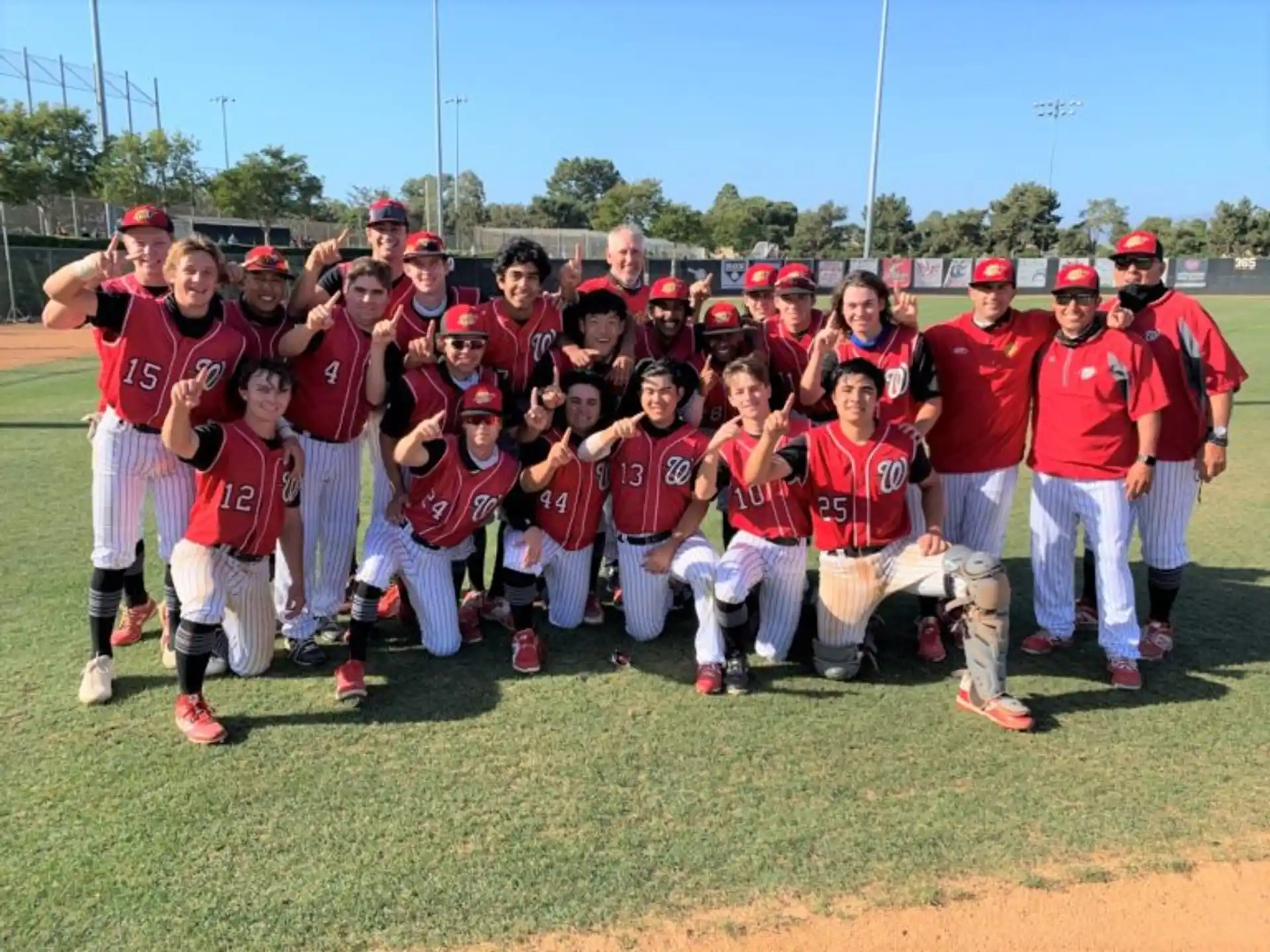 a group of baseball players posing for a photo