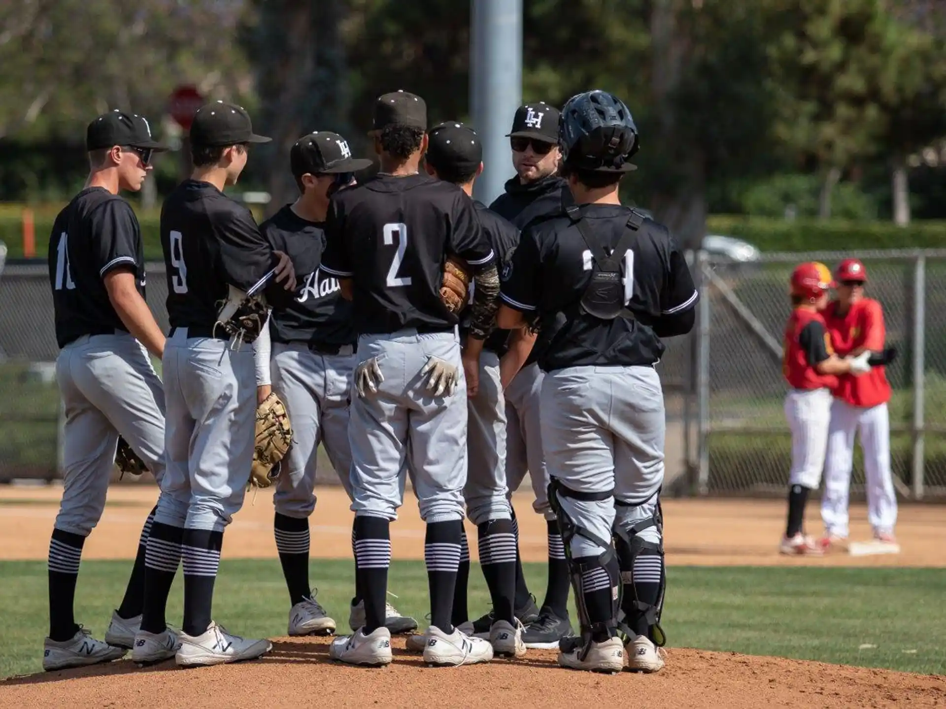 a group of baseball players standing on a field