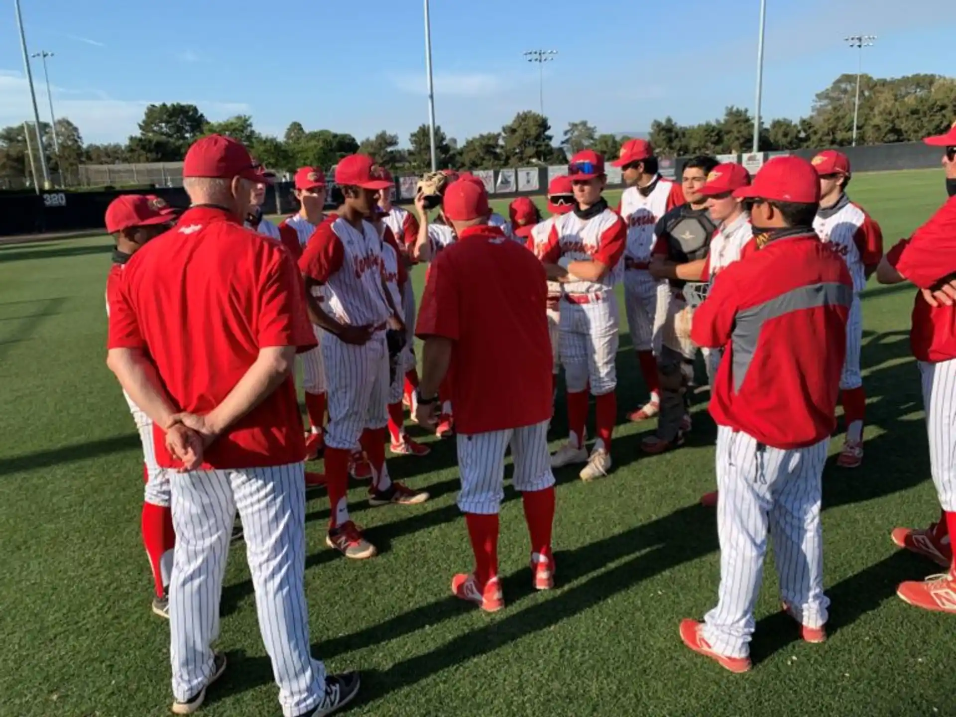 a group of people in red uniforms