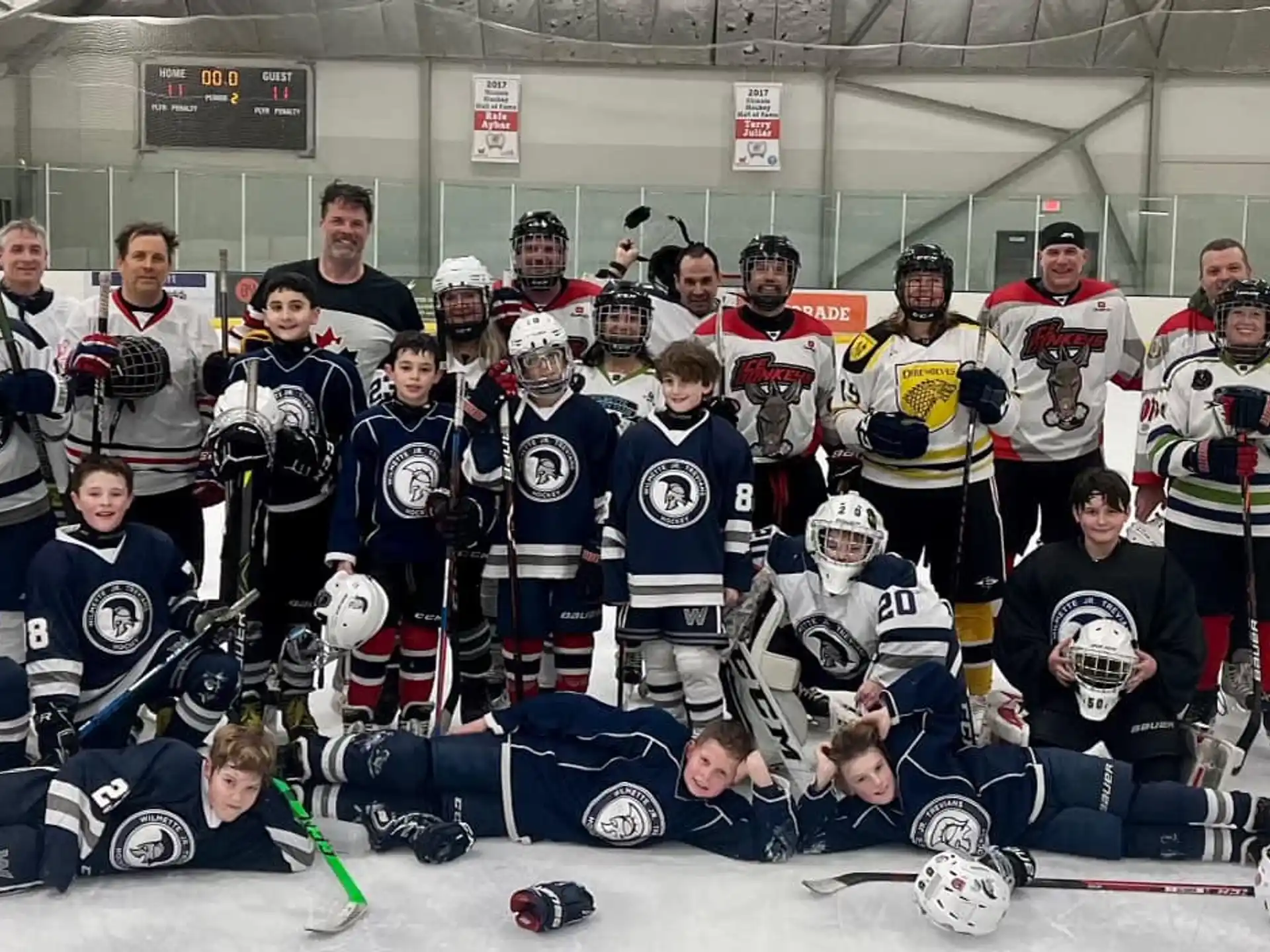 a group of hockey players posing for a photo