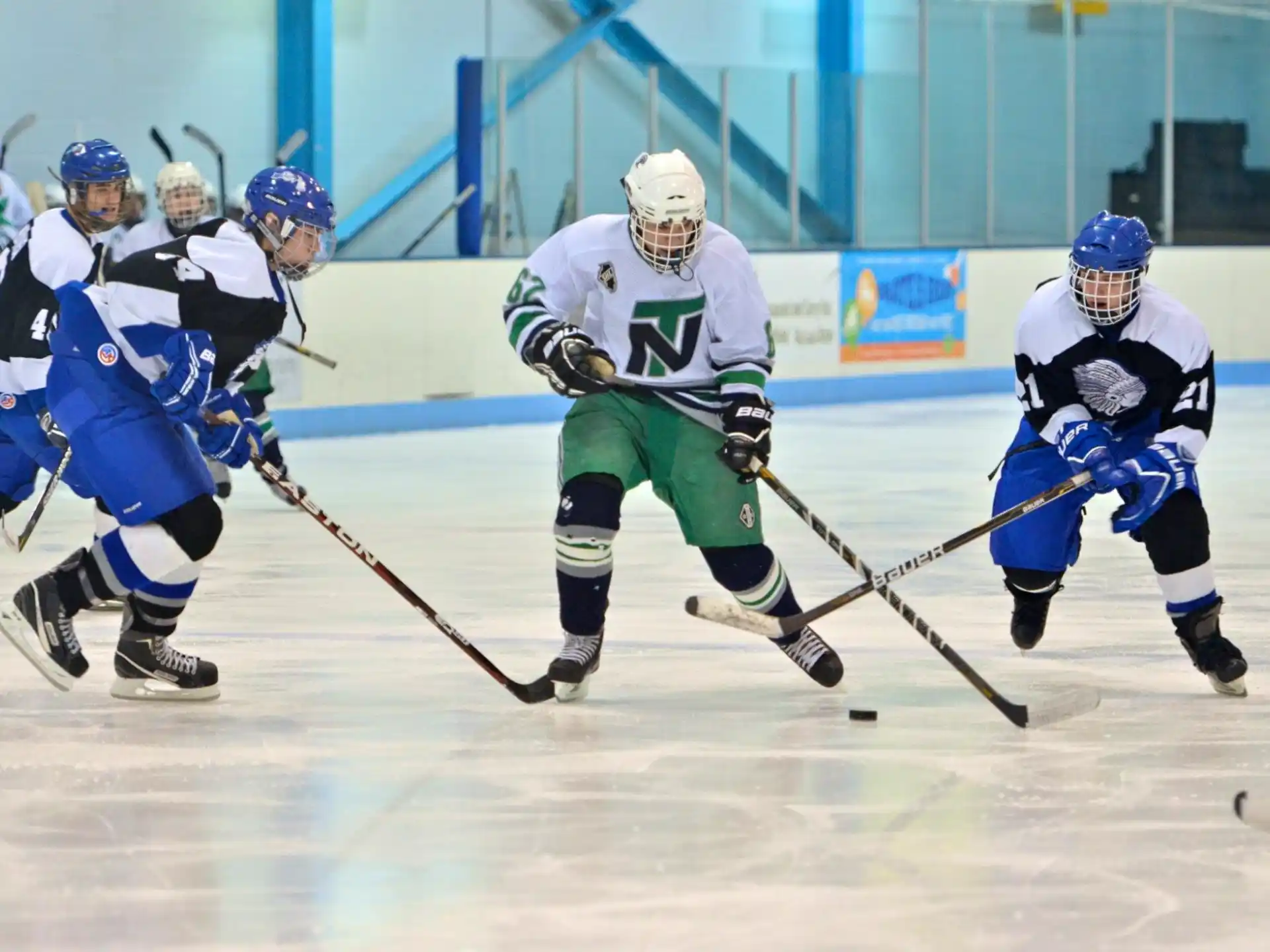 a group of people playing hockey