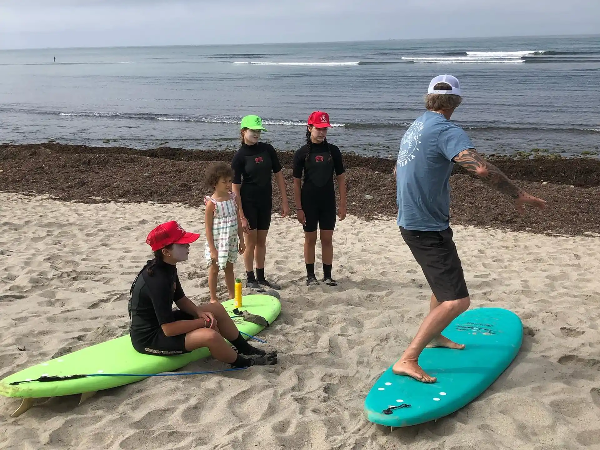 a group of people stand on a beach