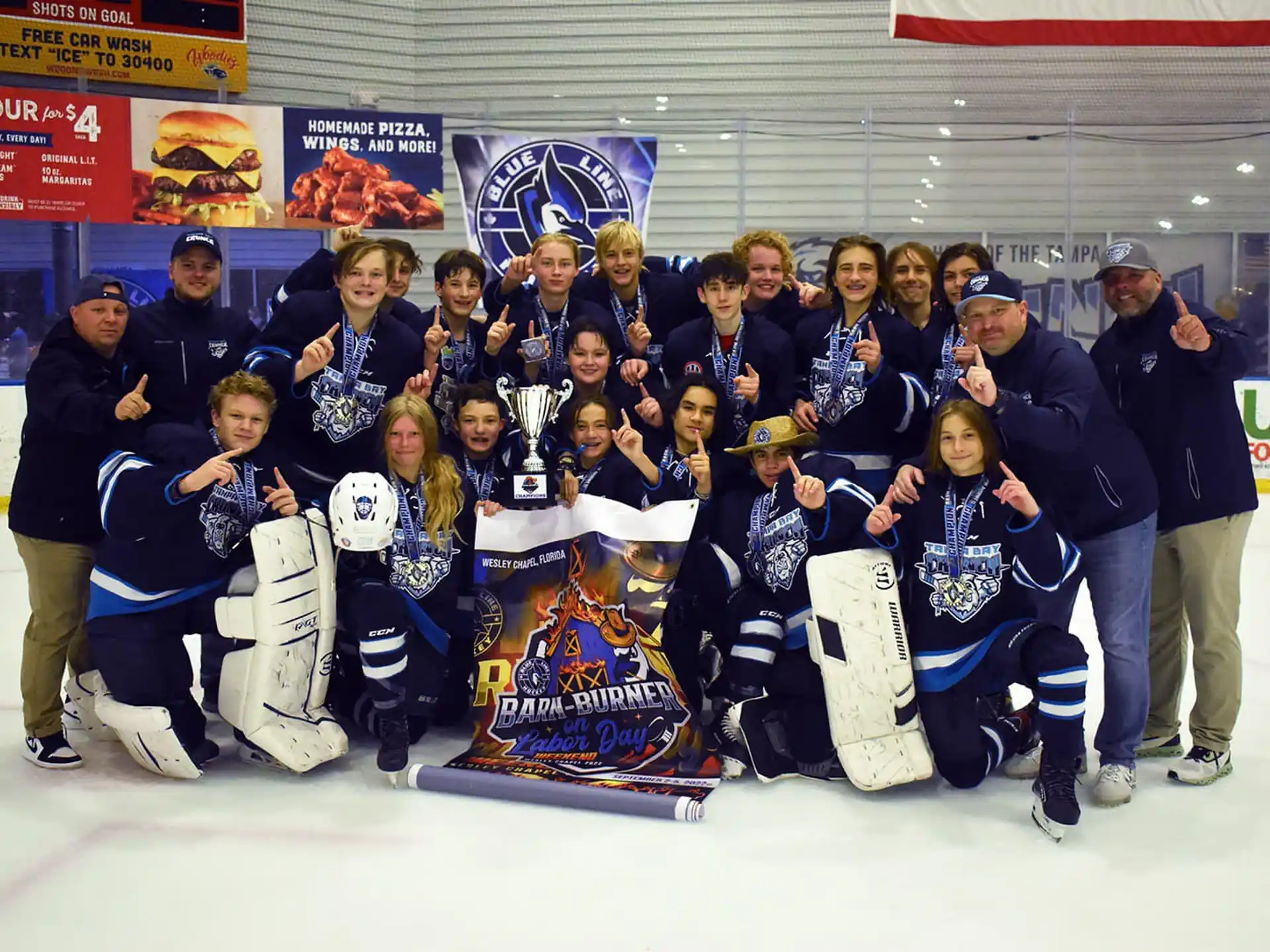 a group of people posing for a photo on ice