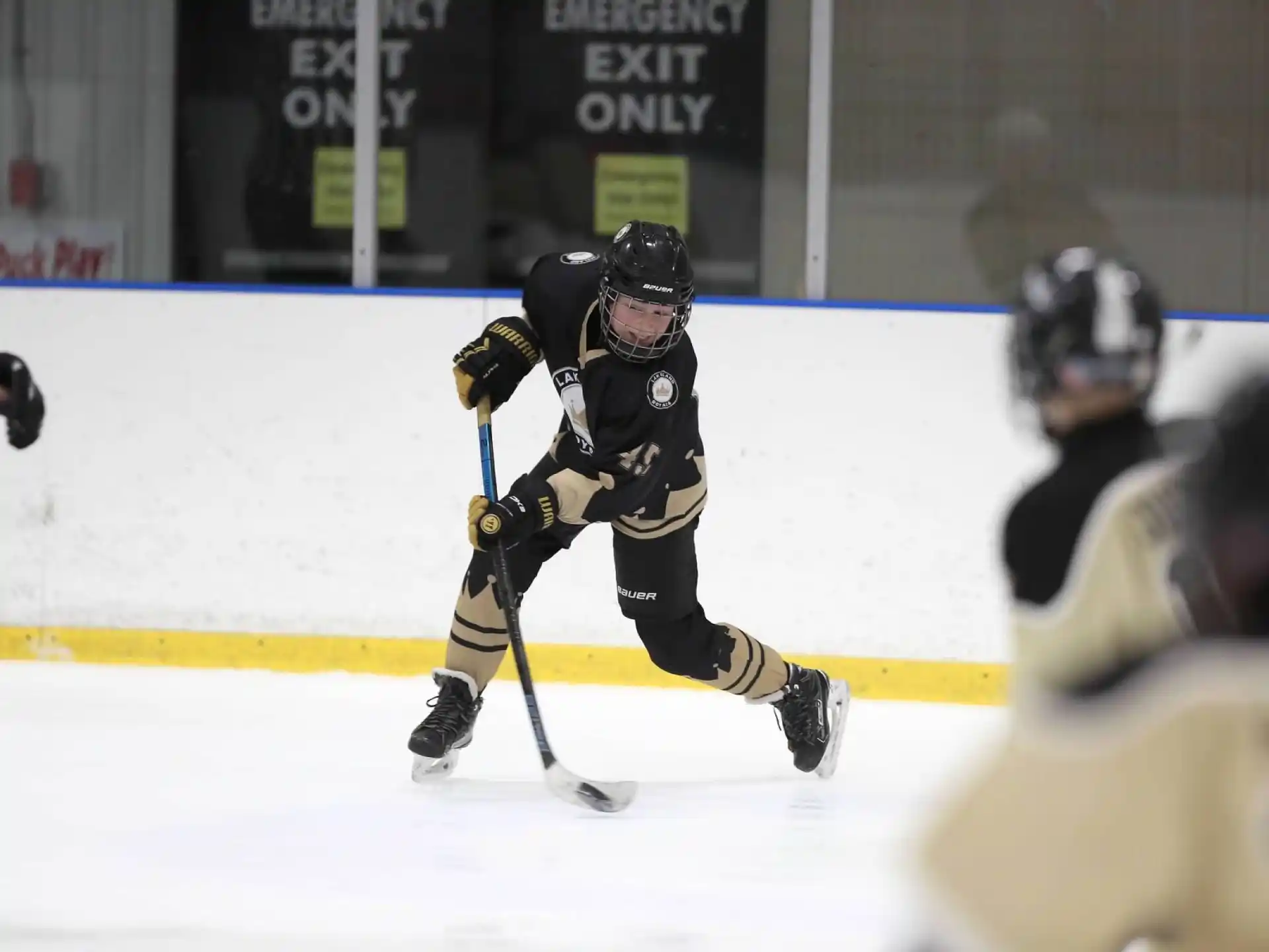 a hockey player in a black uniform