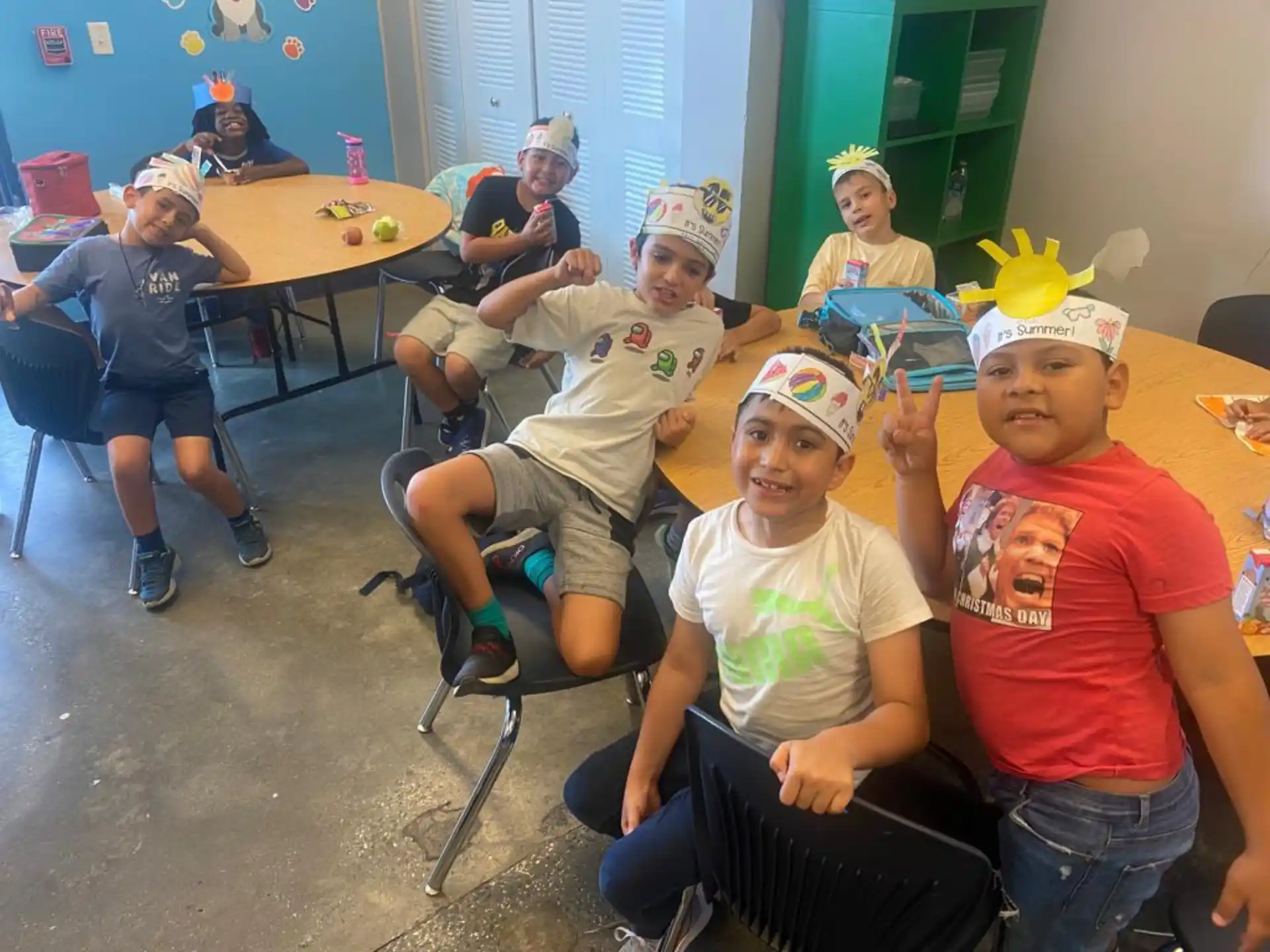 a group of children wearing party hats