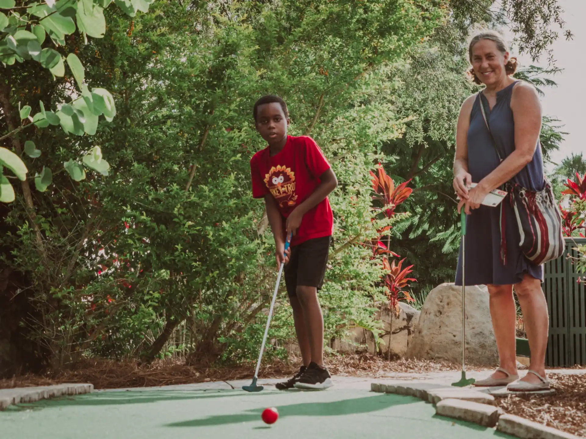 a couple of women playing golf