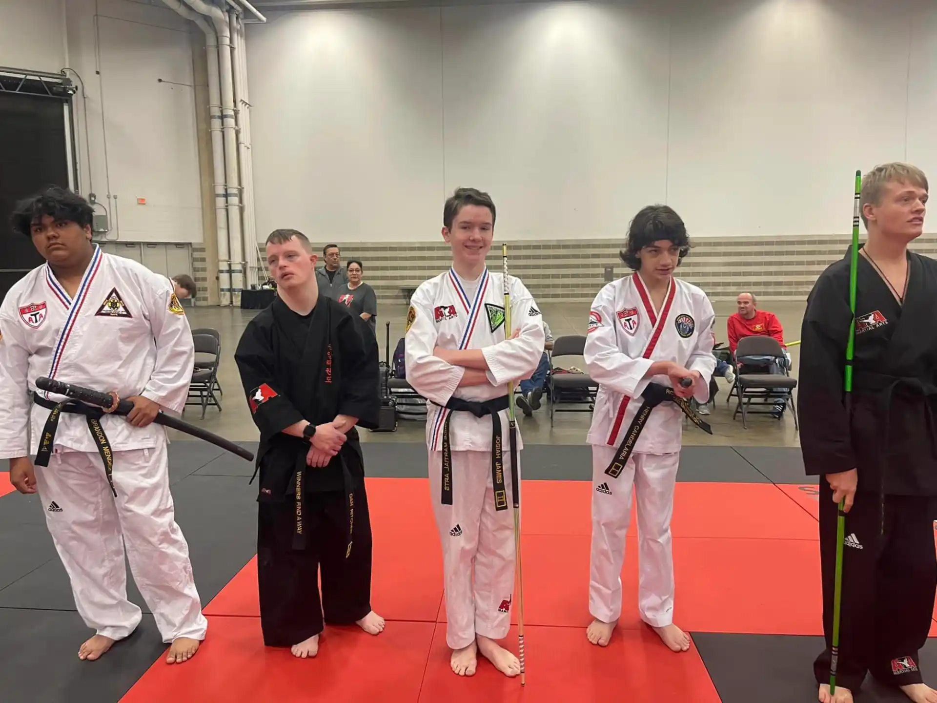 a group of people in karate uniforms