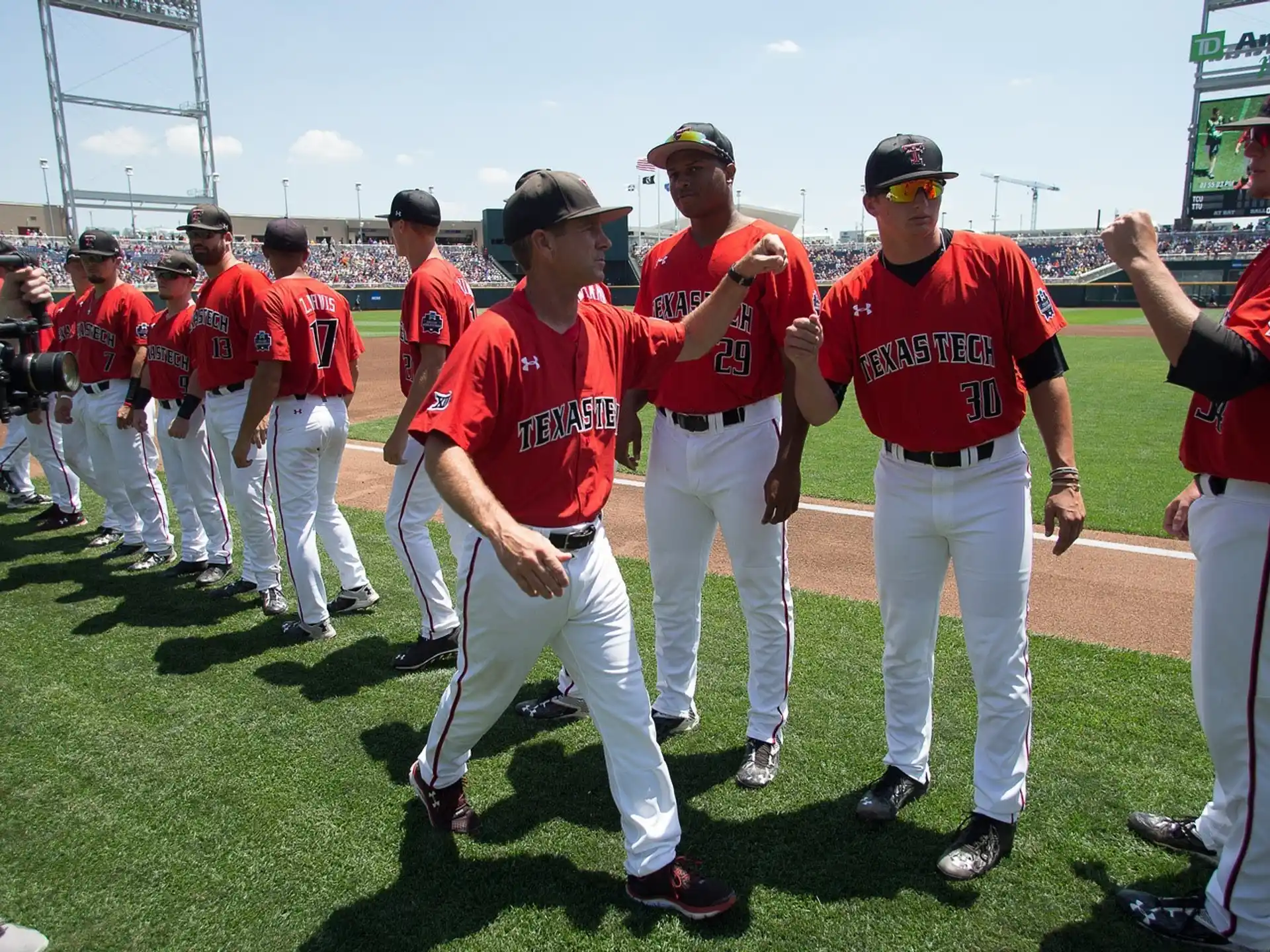 a group of baseball players walking on a field
