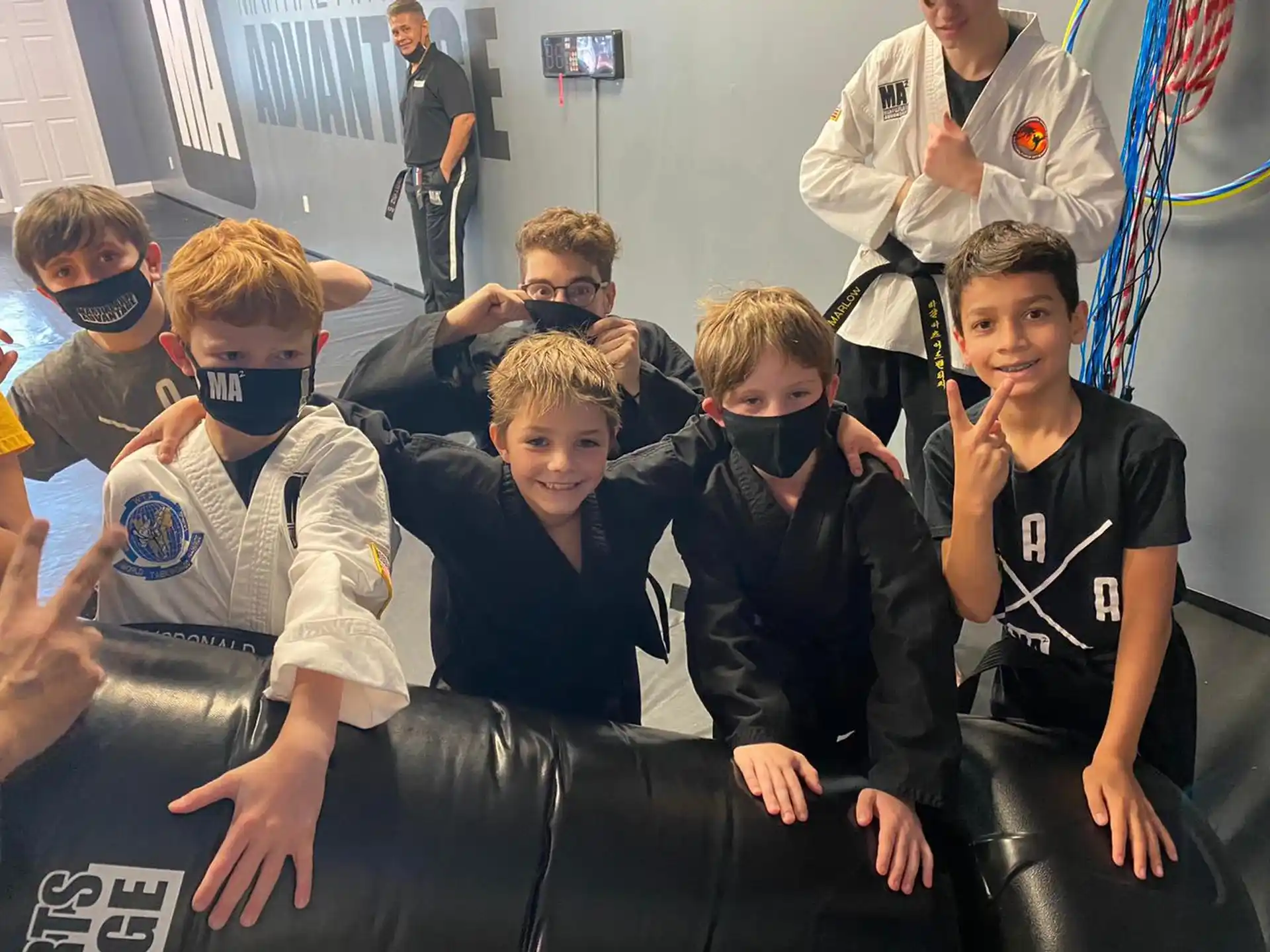 a group of boys wearing face masks