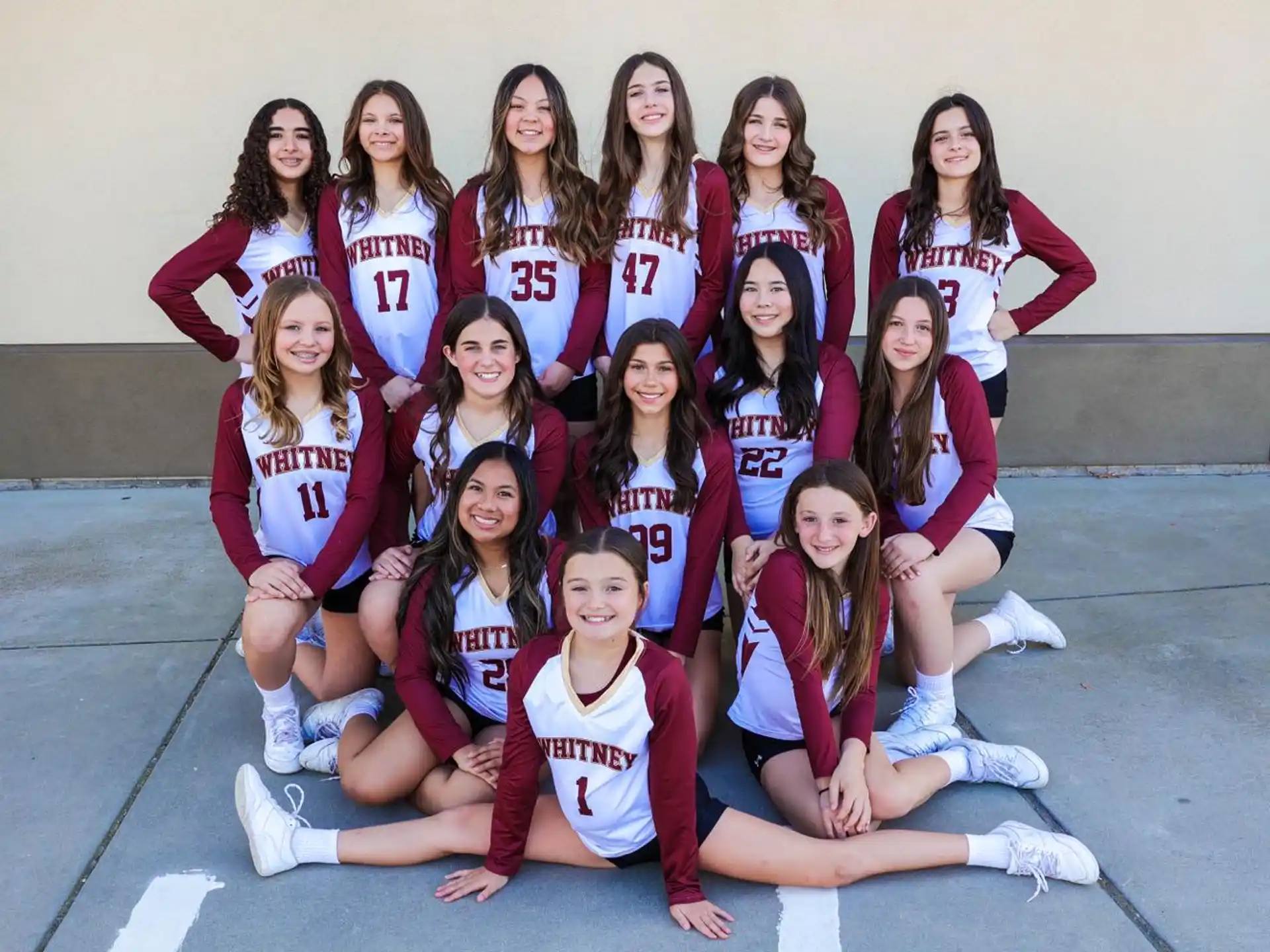 a group of girls posing for a photo