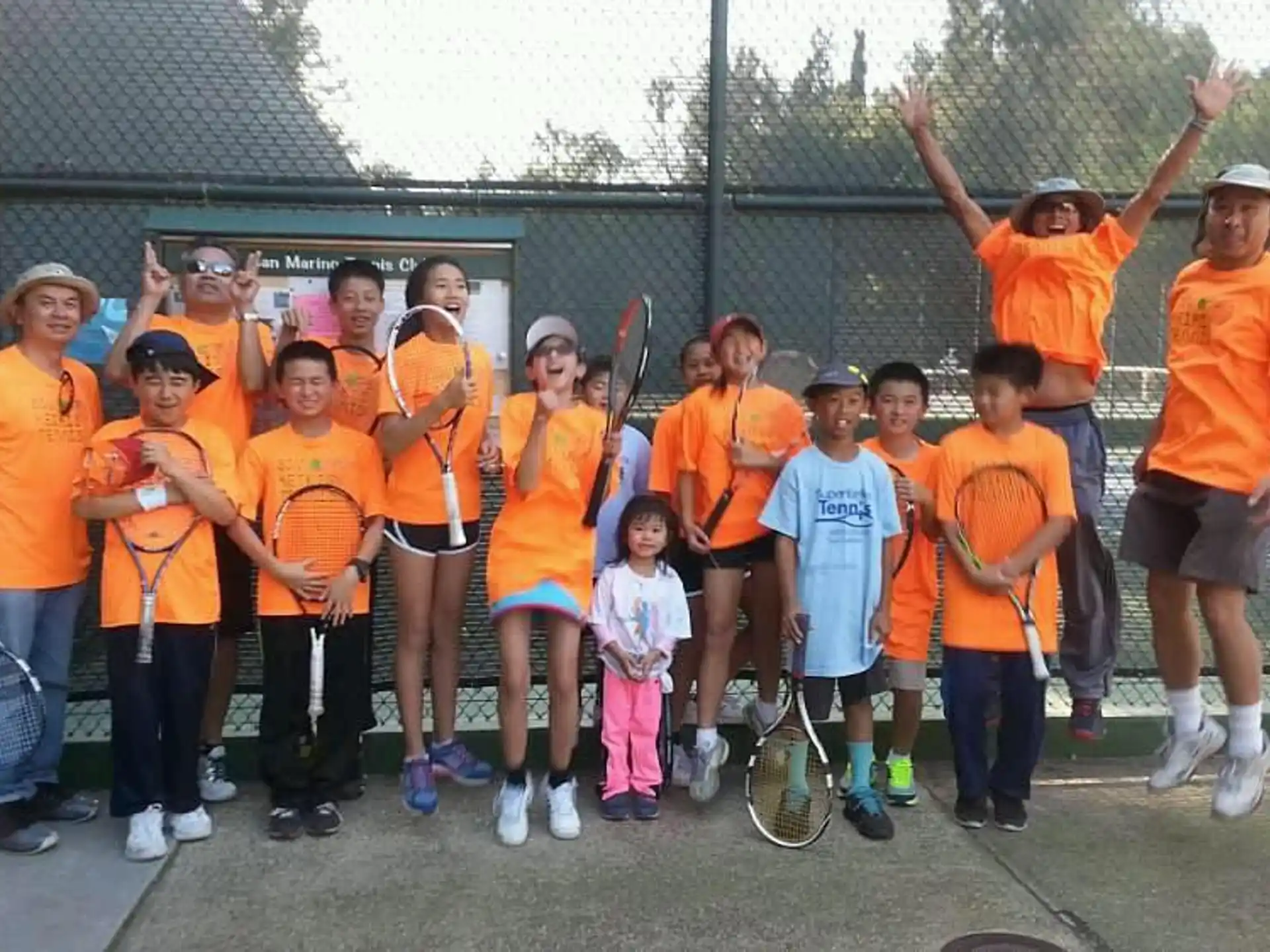 a group of kids posing for a photo